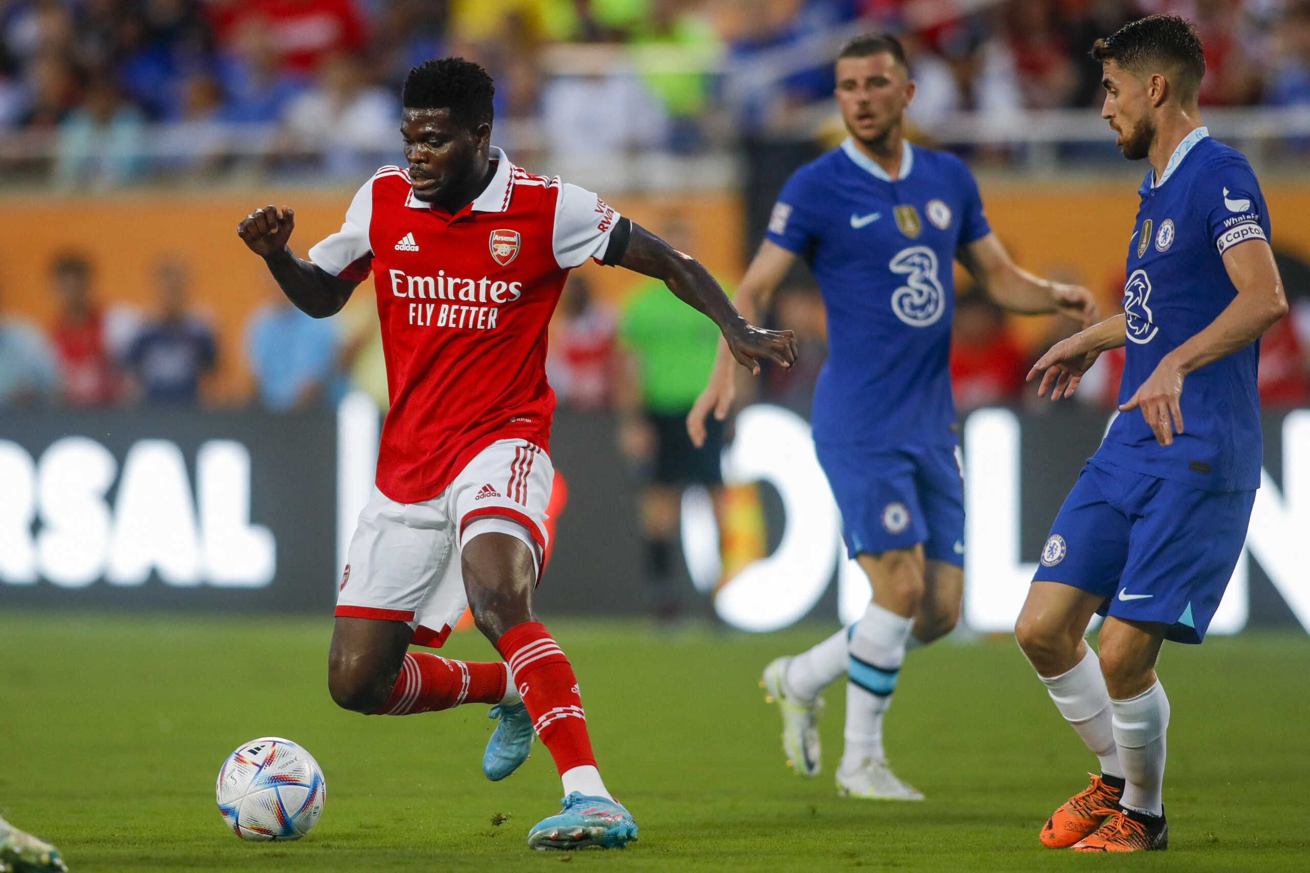 Jul 23, 2022; Orlando, FL, USA; Arsenal midfielder Thomas Partey (5) runs with the ball against Chelsea midfielder Jorginho (5) during the first half at Camping World Stadium. Mandatory Credit: Sam Navarro-USA TODAY Sports