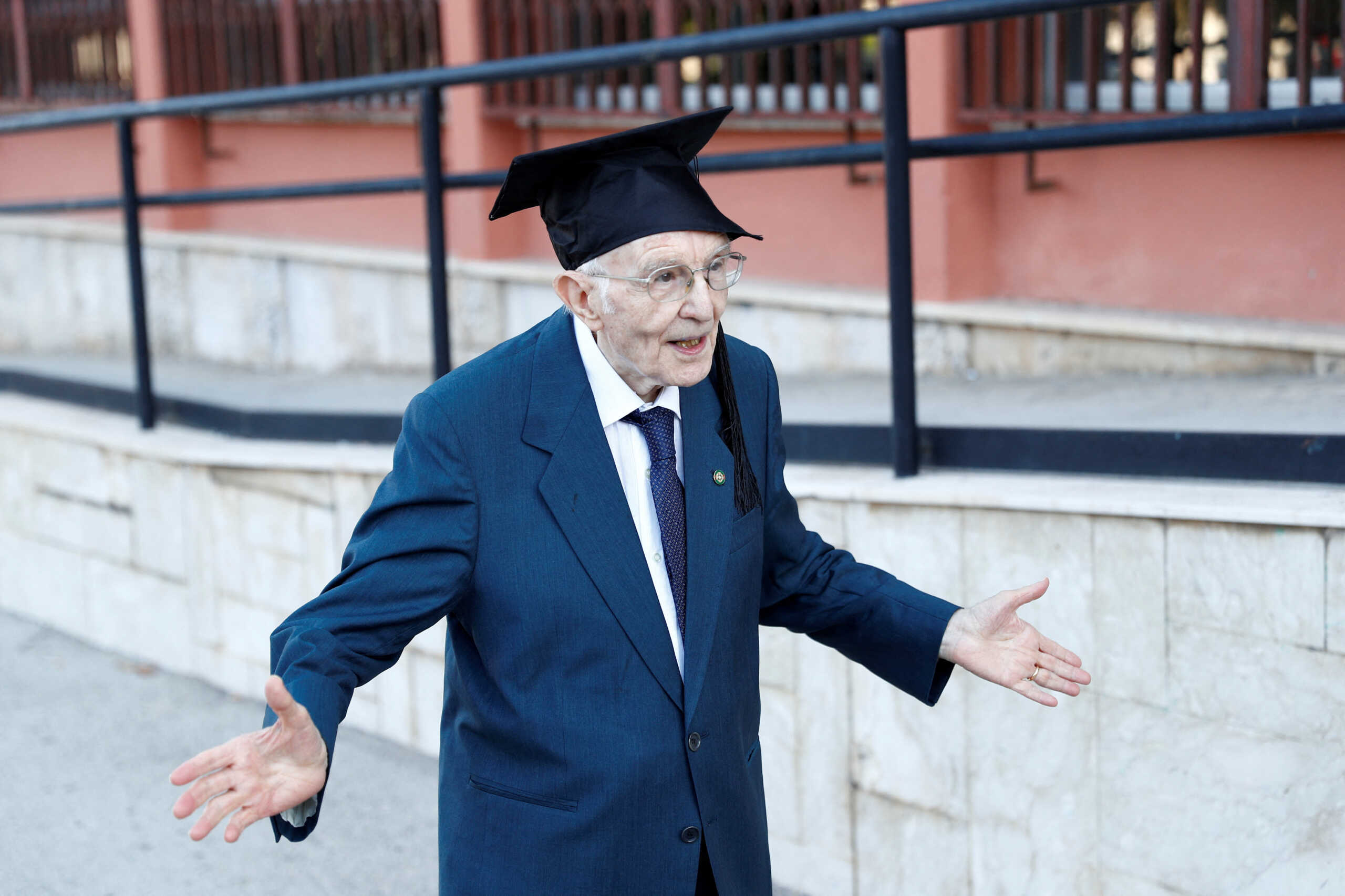 FILE PHOTO: Giuseppe Paterno, 96, Italy's oldest student, celebrates after graduating from his undergraduate degree in history and philosophy during his graduation at the University of Palermo, in Palermo, Italy, July 29, 2020. REUTERS
