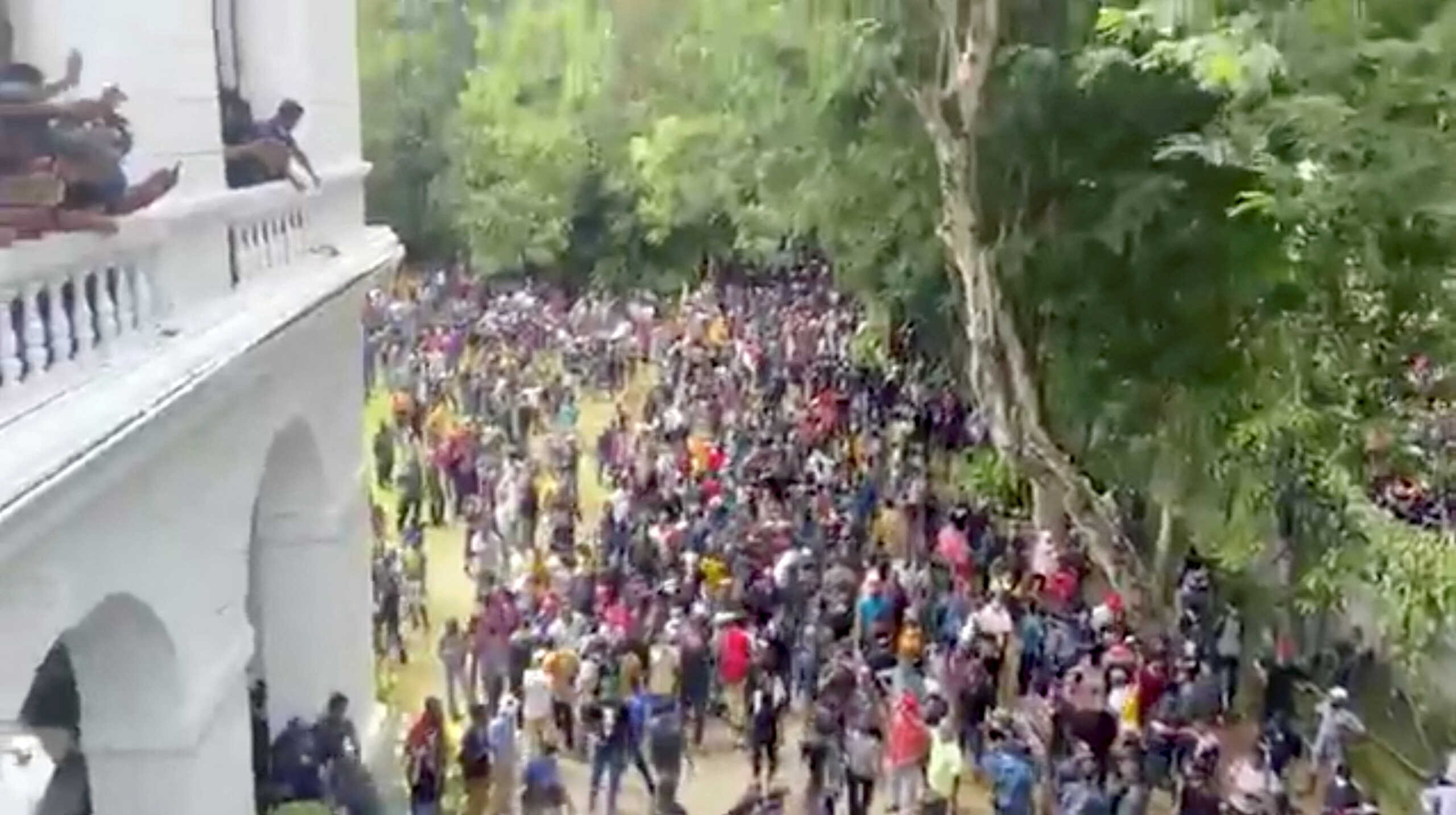 Demonstrators protest inside the President's House, after President Gotabaya Rajapaksa fled, amid the country's economic crisis, in Colombo, Sri Lanka, in this screengrab obtained from social media video on July 9, 2022. News Cutter via REUTERS ATTENTION EDITORS - THIS IMAGE HAS BEEN SUPPLIED BY A THIRD PARTY. MANDATORY CREDIT. NO RESALES. NO ARCHIVES.