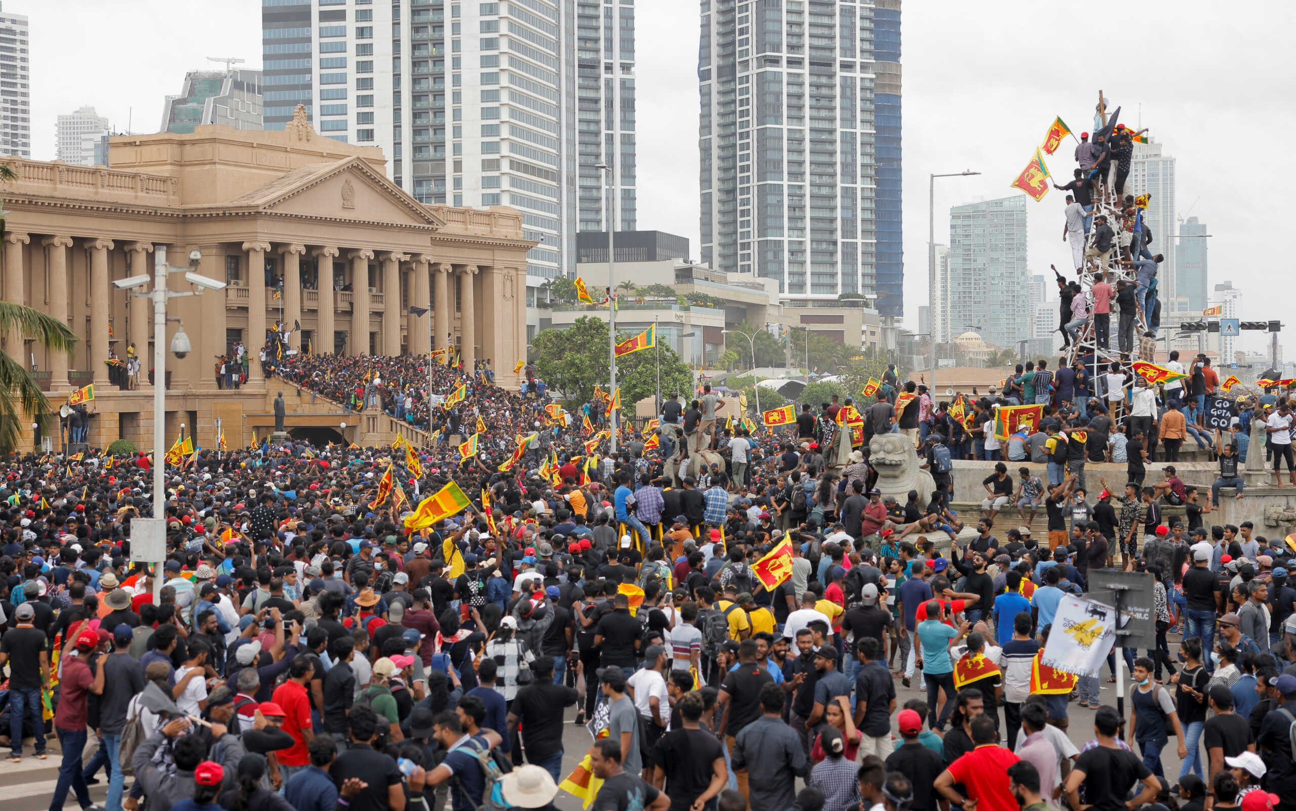 Demonstrators celebrate after entering the Presidential Secretariat during a protest, after President Gotabaya Rajapaksa fled, amid the country's economic crisis, in Colombo, Sri Lanka July 9, 2022. REUTERS