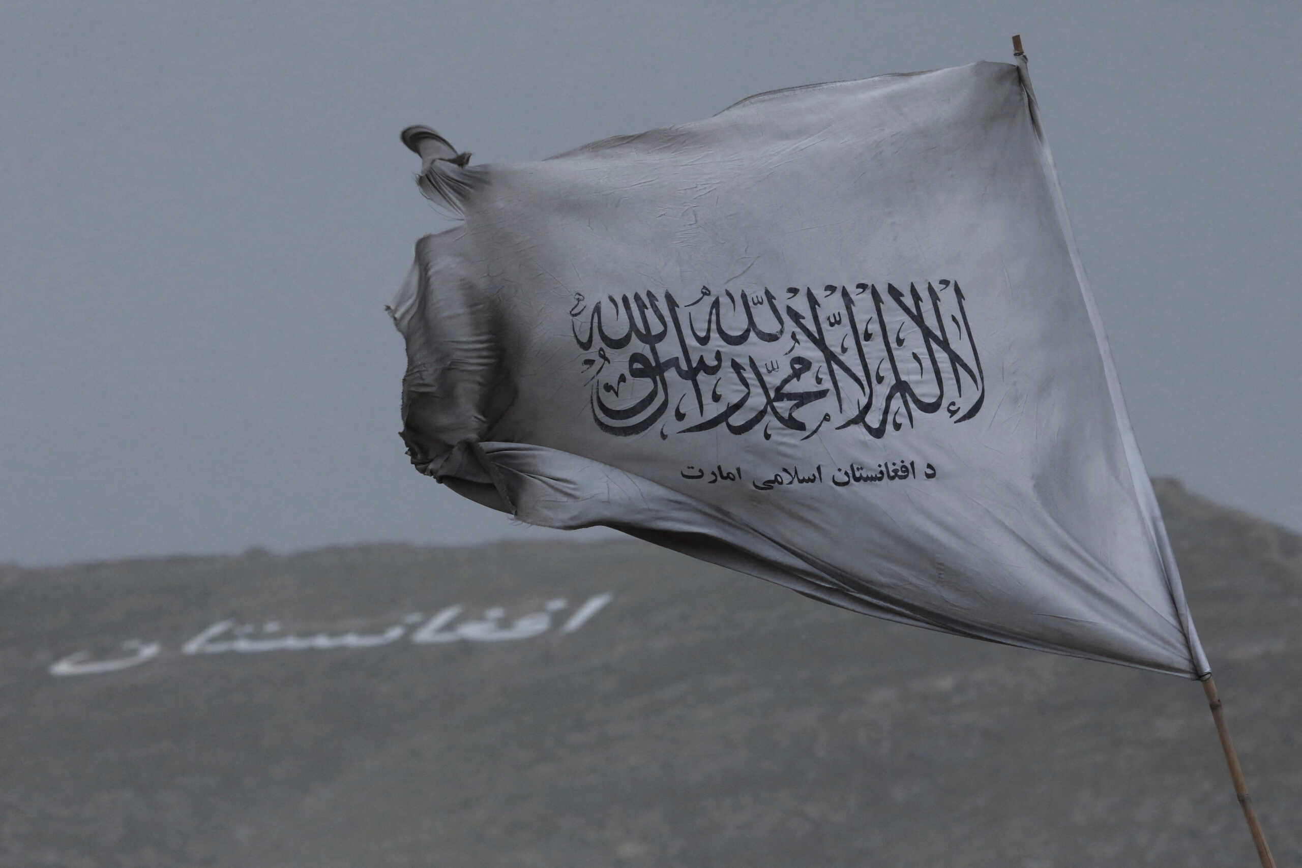 FILE PHOTO: The Taliban flag is seen in a marketplace in Kabul, Afghanistan, May 10, 2022. REUTERS