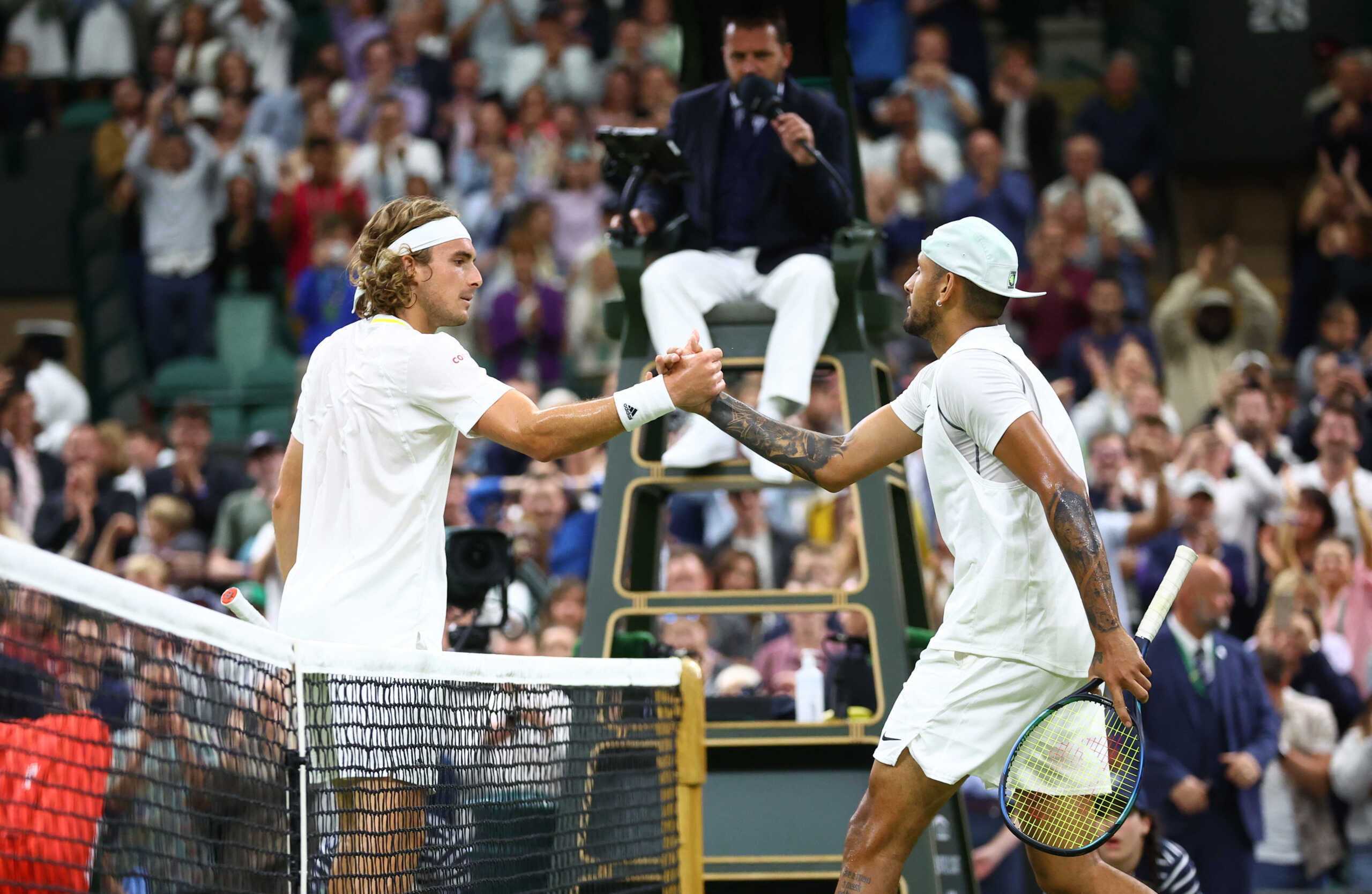 Tennis - Wimbledon - All England Lawn Tennis and Croquet Club, London, Britain - July 2, 2022 Australia's Nick Kyrgios with Greece's Stefanos Tsitsipas after winning their third round match REUTERS
