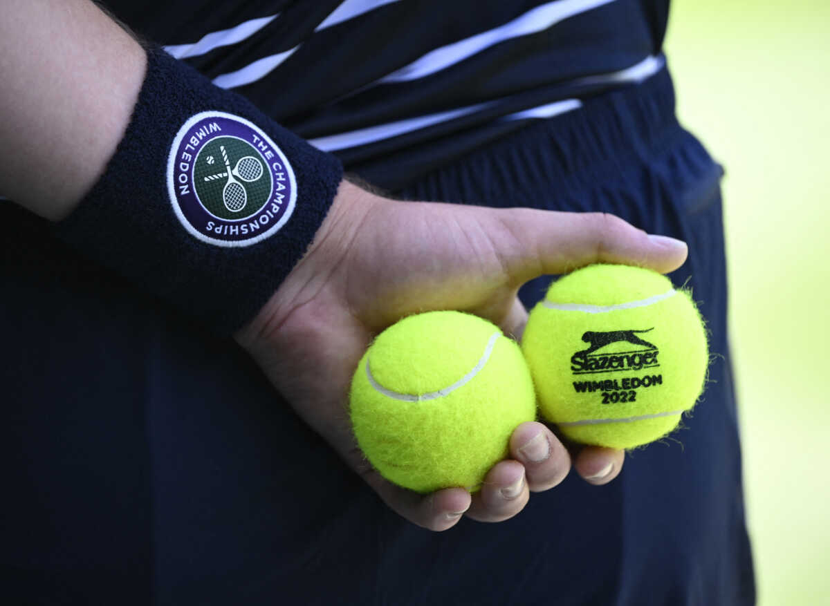 Tennis - Wimbledon - All England Lawn Tennis and Croquet Club, London, Britain - July 10, 2022 General view of tennis balls being held during the men's singles final between Australia's Nick Kyrgios and Serbia's Novak Djokovic REUTERS