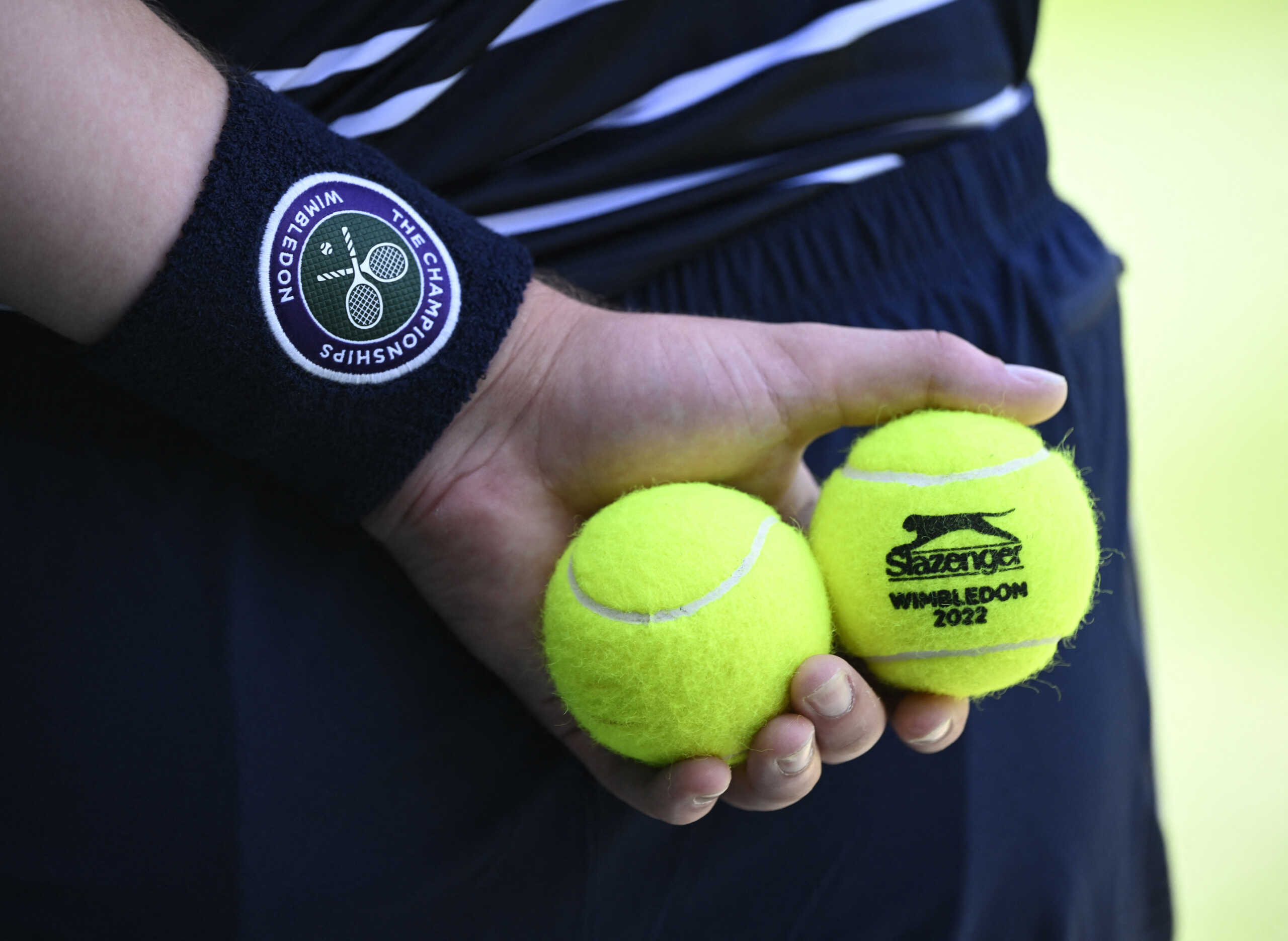 Tennis - Wimbledon - All England Lawn Tennis and Croquet Club, London, Britain - July 10, 2022 General view of tennis balls being held during the men's singles final between Australia's Nick Kyrgios and Serbia's Novak Djokovic REUTERS