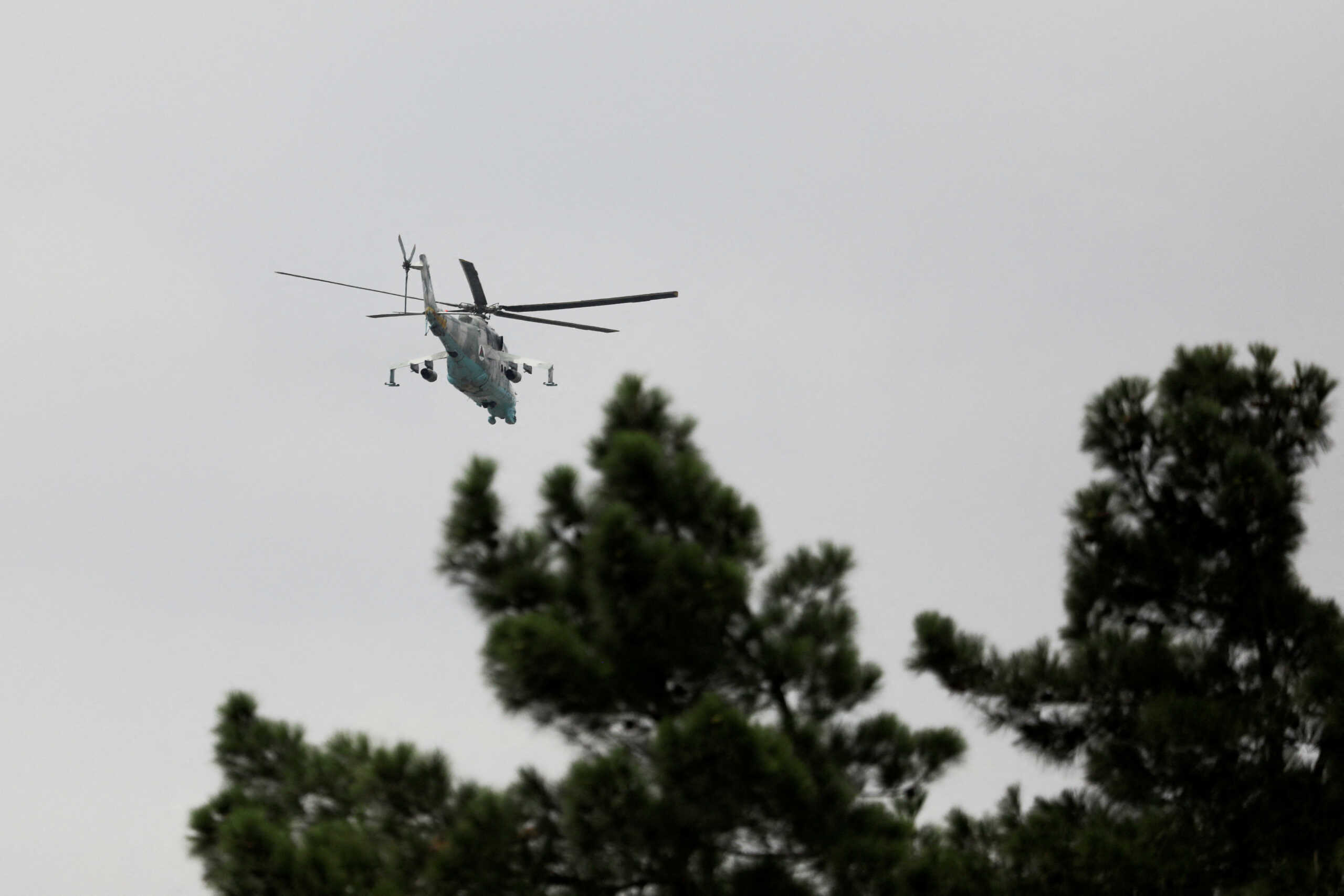 A Taliban Mil Mi-24 military helicopter flies over Kabul, Afghanistan August 17, 2022. REUTERS