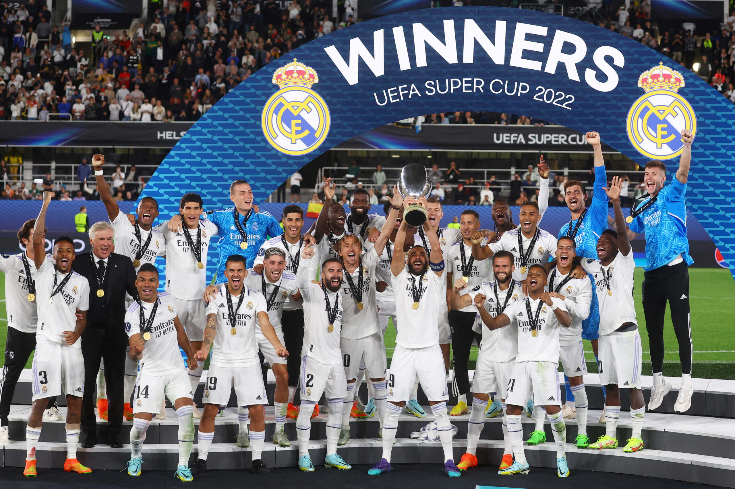 Soccer Football - European Super Cup - Real Madrid v Eintracht Frankfurt - Helsinki Olympic Stadium, Helsinki, Finland - August 10, 2022 Real Madrid's Karim Benzema lifts the trophy as he celebrates with teammates after winning the European Super Cup REUTERS