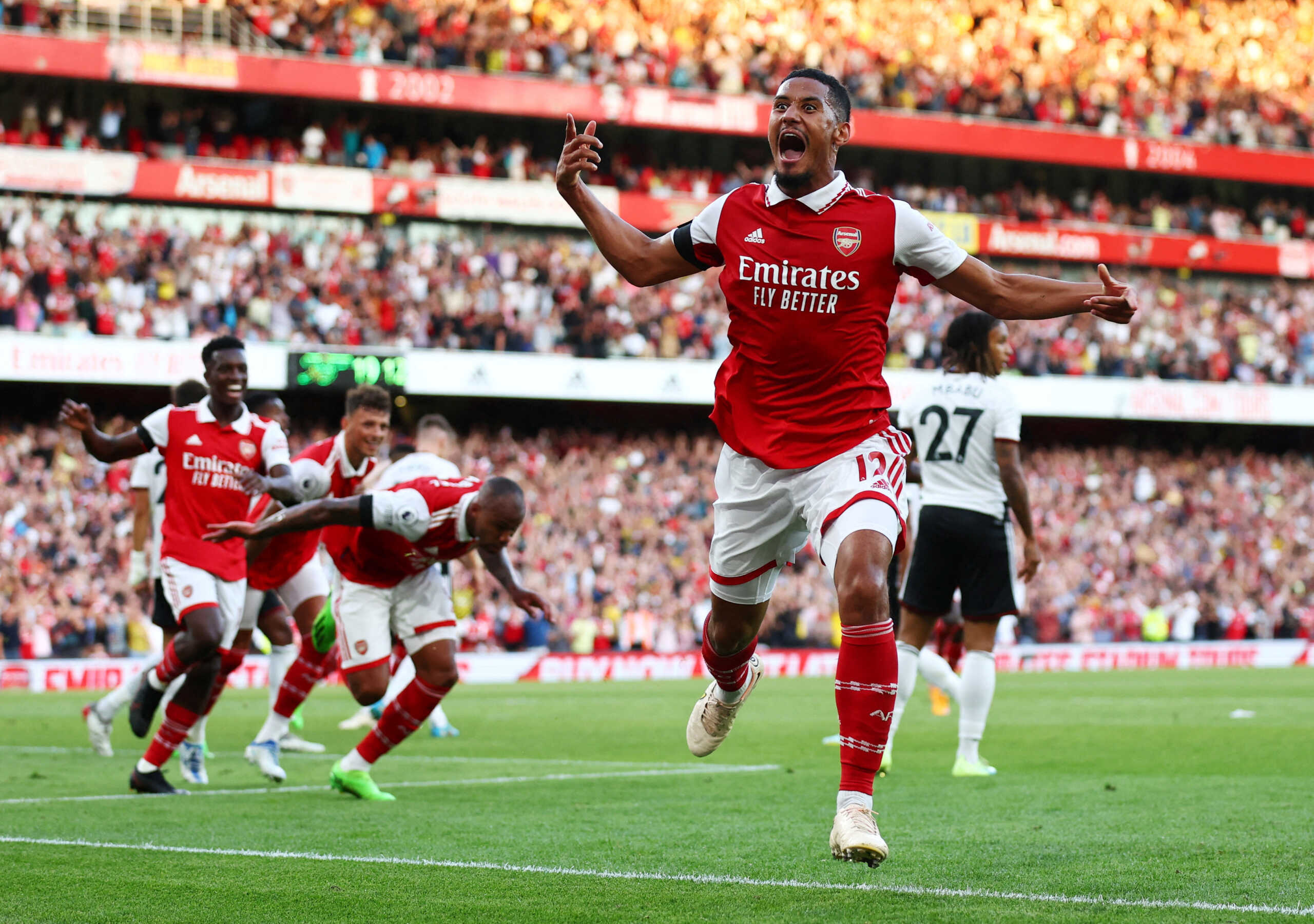 Soccer Football - Premier League - Arsenal v Fulham - Emirates Stadium, London, Britain - August 27, 2022 Arsenal's William Saliba celebrates their second goal scored by Gabriel REUTERS