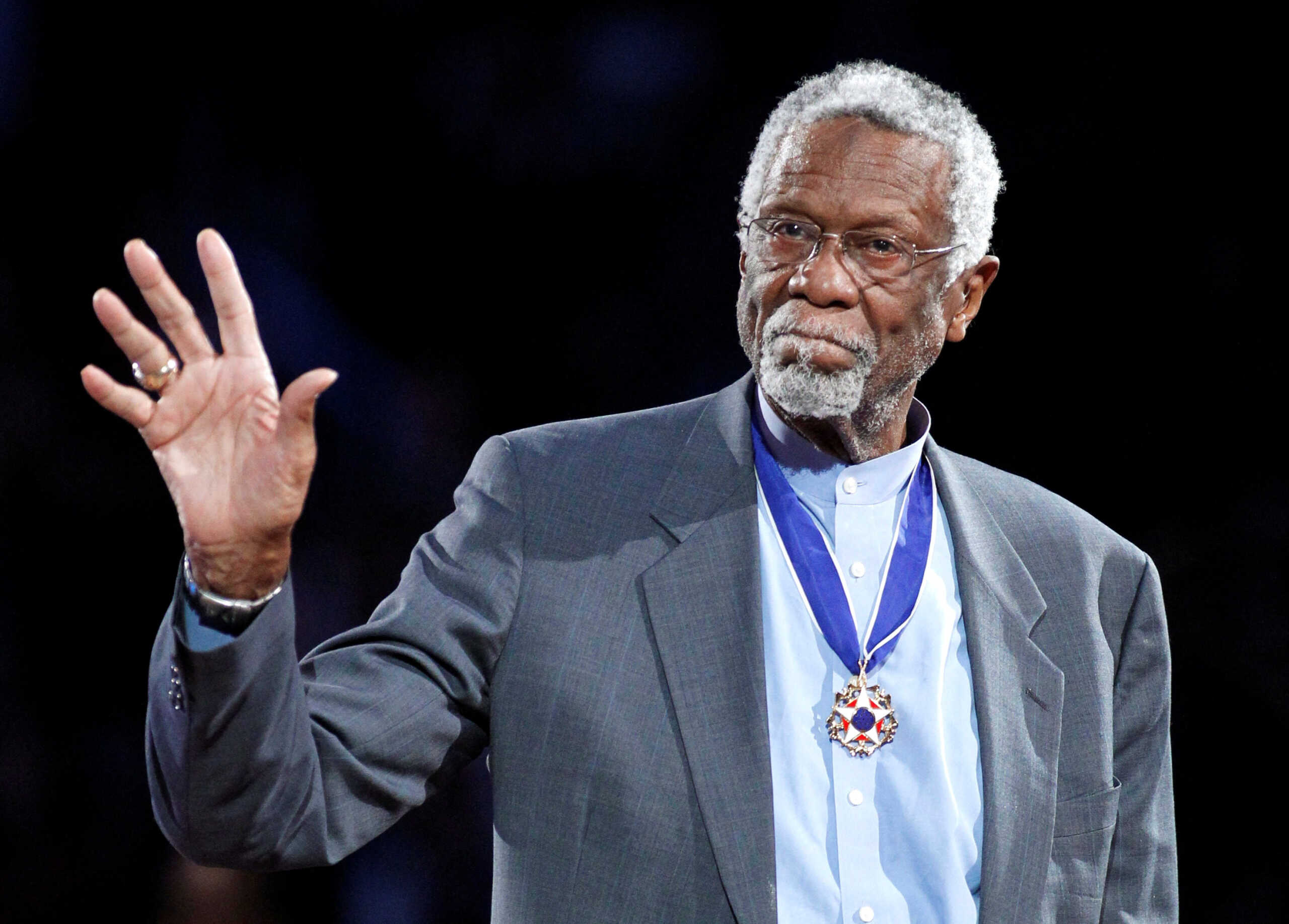 FILE PHOTO: Boston Celtics' great Bill Russell stands with his Presidential Medal of Freedom during the NBA All-Star basketball game in Los Angeles, February 20, 2011.  REUTERS