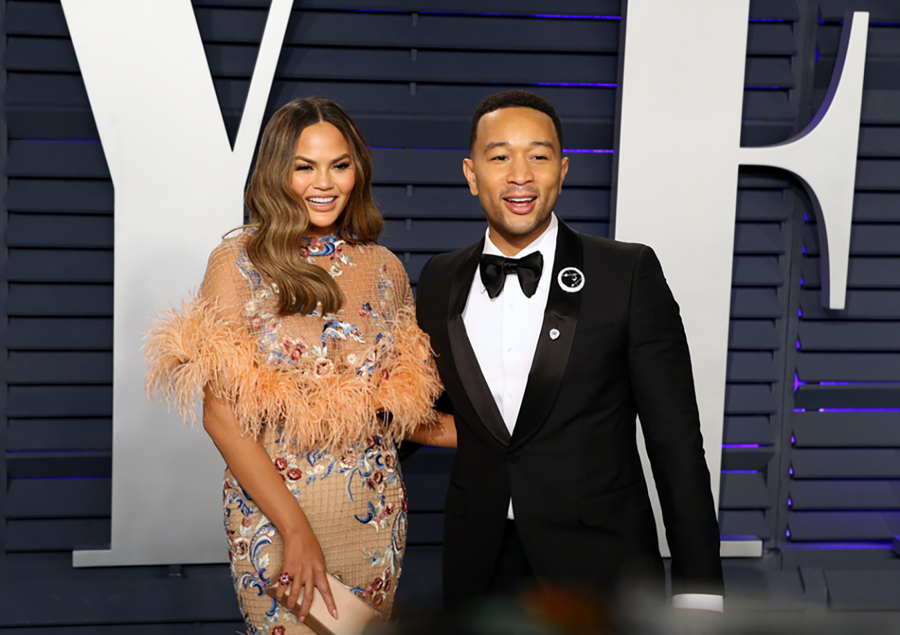 epa07395663 Chrissy Teigen (L) and John Legend (R) pose at the 2019 Vanity Fair Oscar Party following the 91st annual Academy Awards ceremony, in Beverly Hills, California, USA, 24 February 2019. The Oscars are presented for outstanding individual or collective efforts in 24 categories in filmmaking. The Oscars are presented for outstanding individual or collective efforts in 24 categories in filmmaking.  EPA