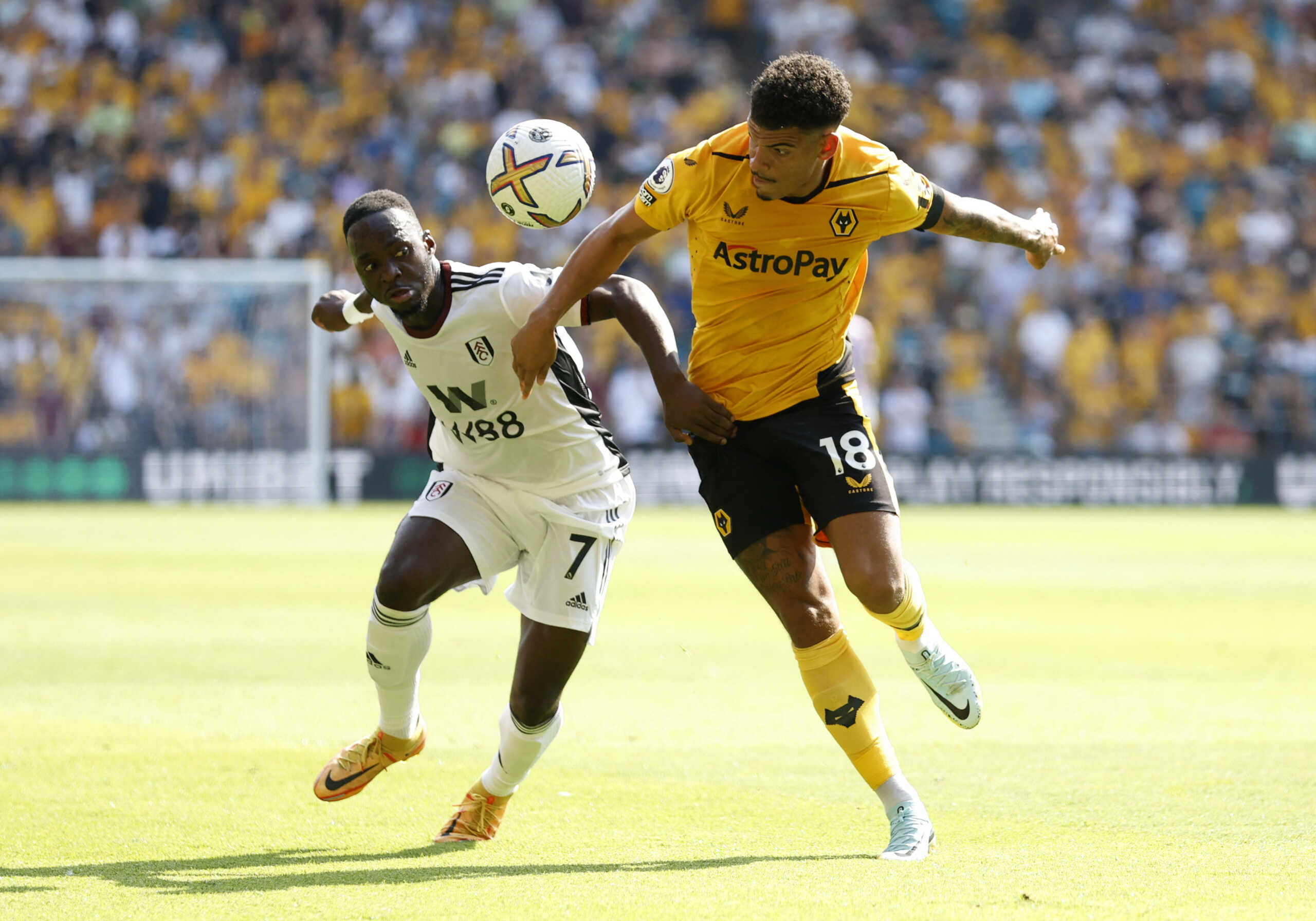 Soccer Football - Premier League - Wolverhampton Wanderers v Fulham - Molineux Stadium, Wolverhampton, Britain - August 13, 2022  Wolverhampton Wanderers' Morgan Gibbs-White in action with Fulham's Neeskens Kebano Action Images via Reuters