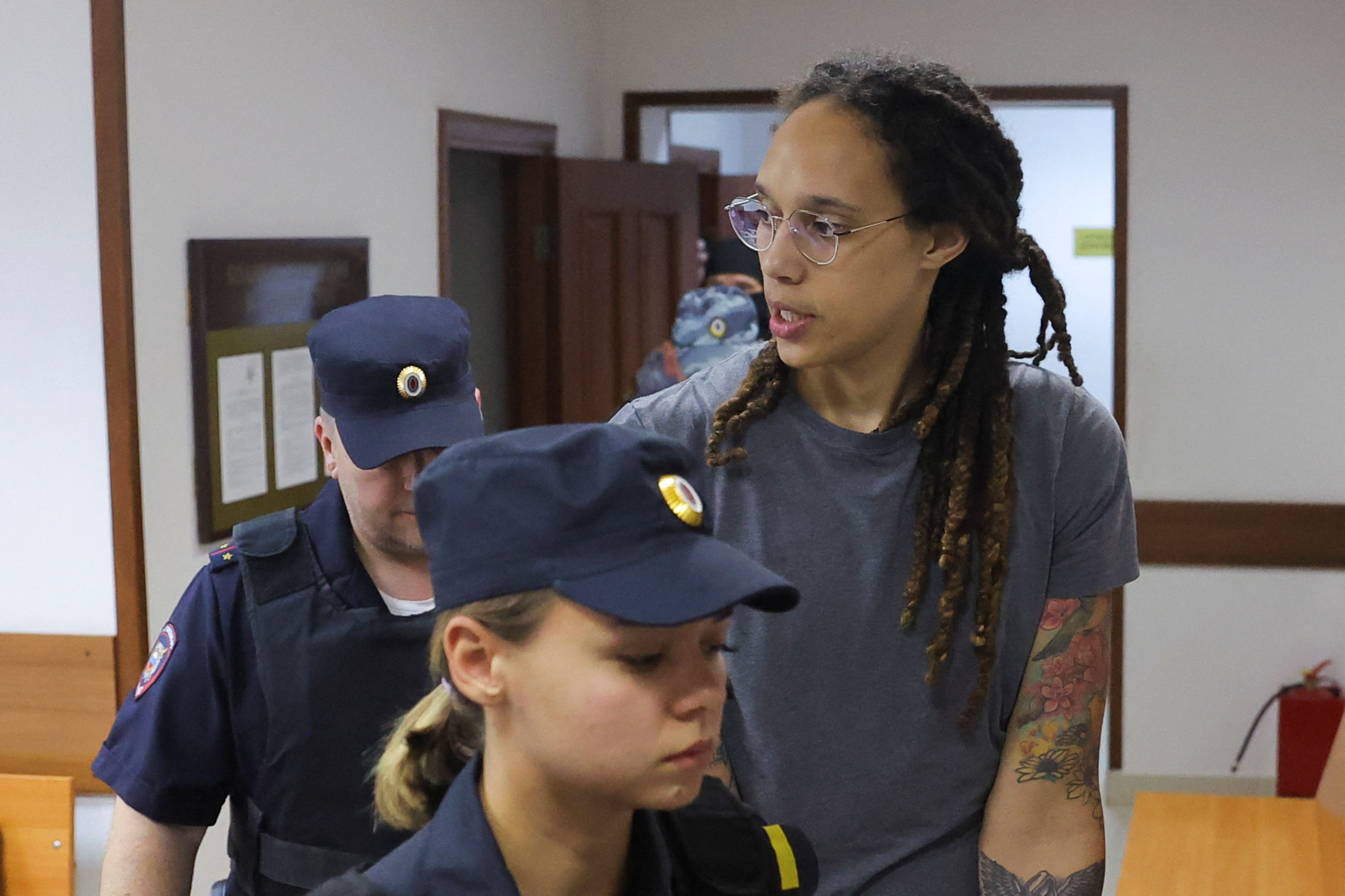 U.S. basketball player Brittney Griner, who was detained at Moscow's Sheremetyevo airport and later charged with illegal possession of cannabis, is escorted after the court's verdict in Khimki outside Moscow, Russia August 4, 2022. REUTERS