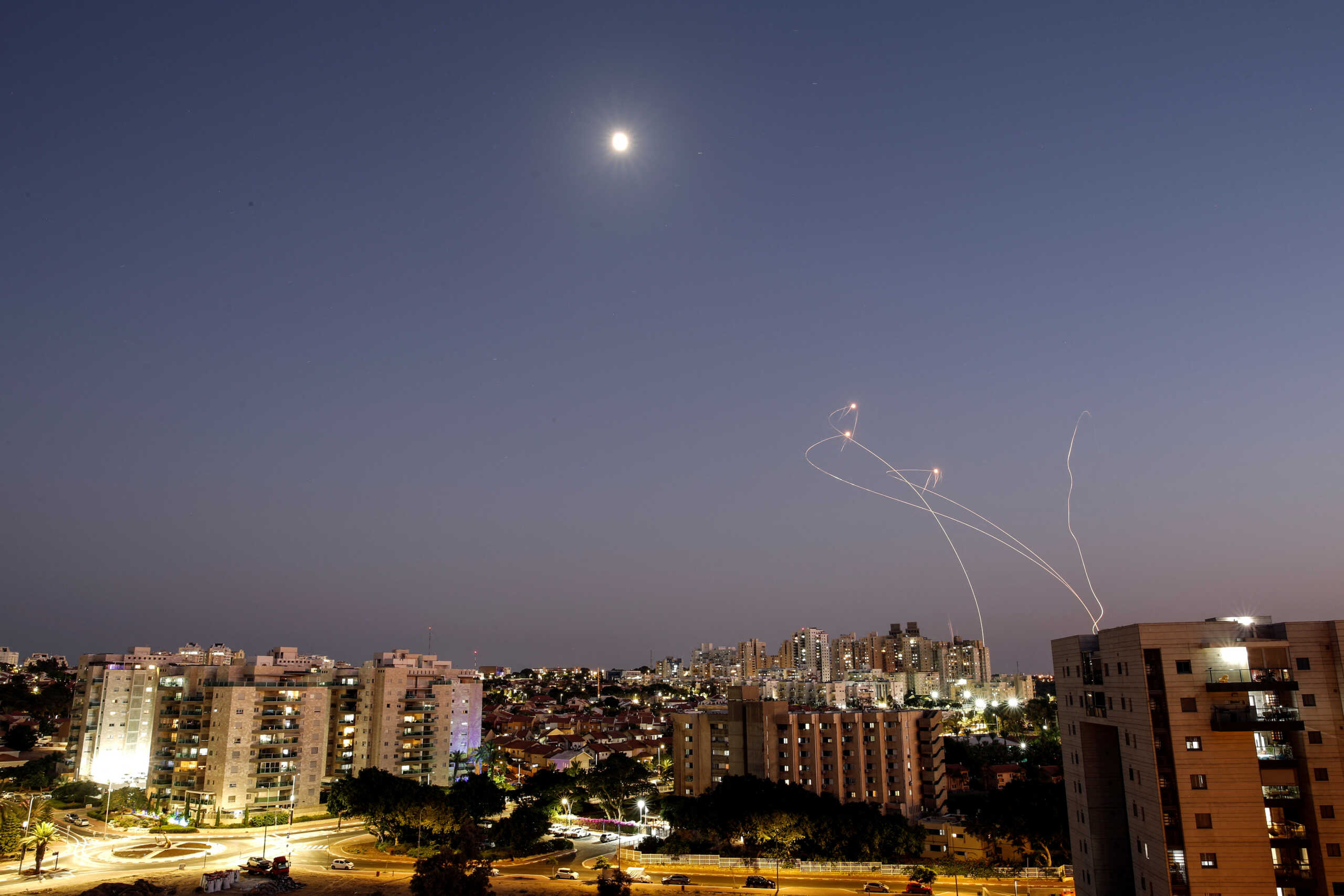 Streaks of light are seen as Israel's Iron Dome anti-missile system intercept rockets launched from the Gaza Strip towards Israel, as seen from Ashkelon, Israel August 7, 2022. REUTERS