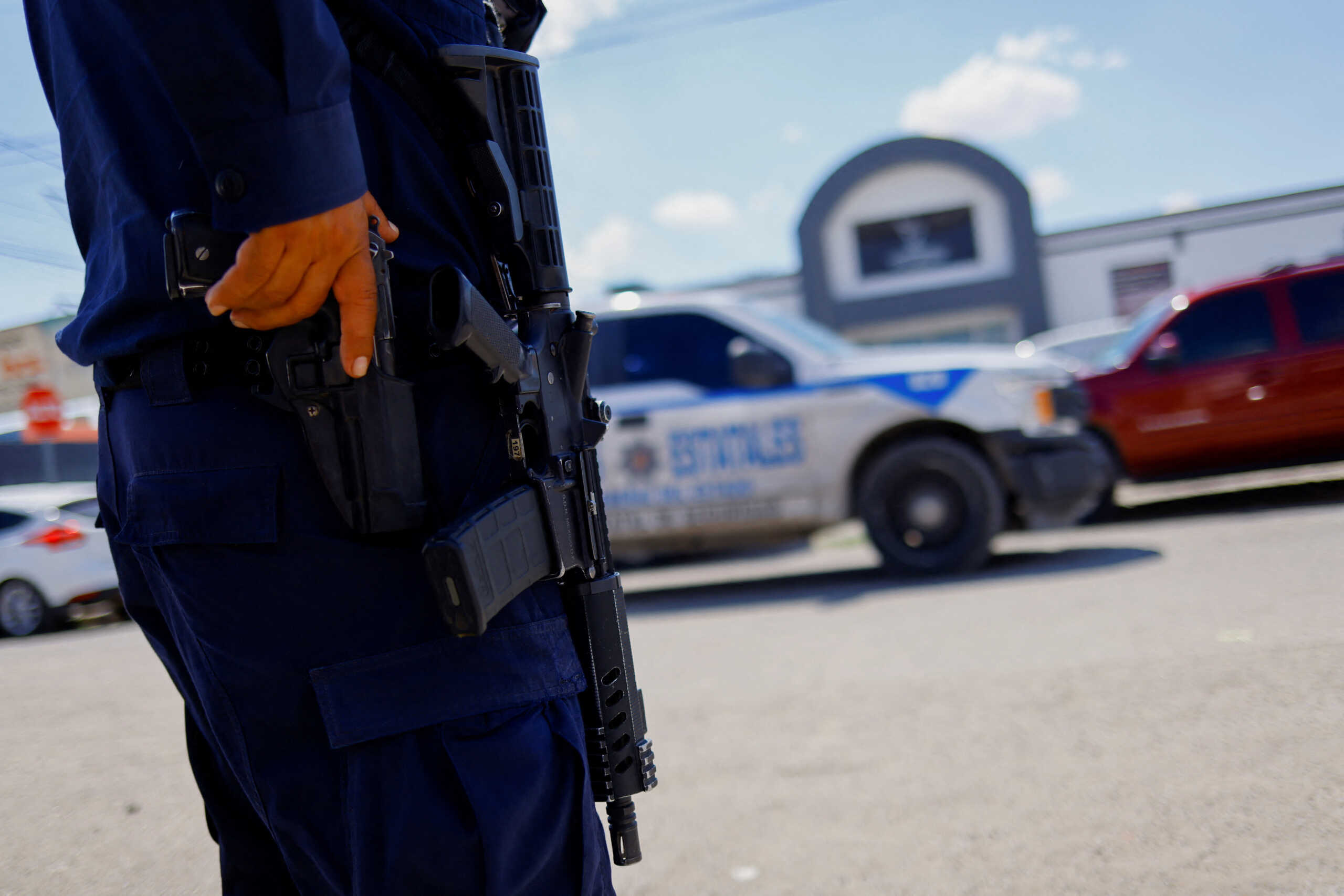 Police guards outside during the wake of Allan Gonzalez, an announcer who was killed by unknown assailants along with three other Switch radio employees, in Ciudad Juarez, Mexico August 14, 2022. REUTERS