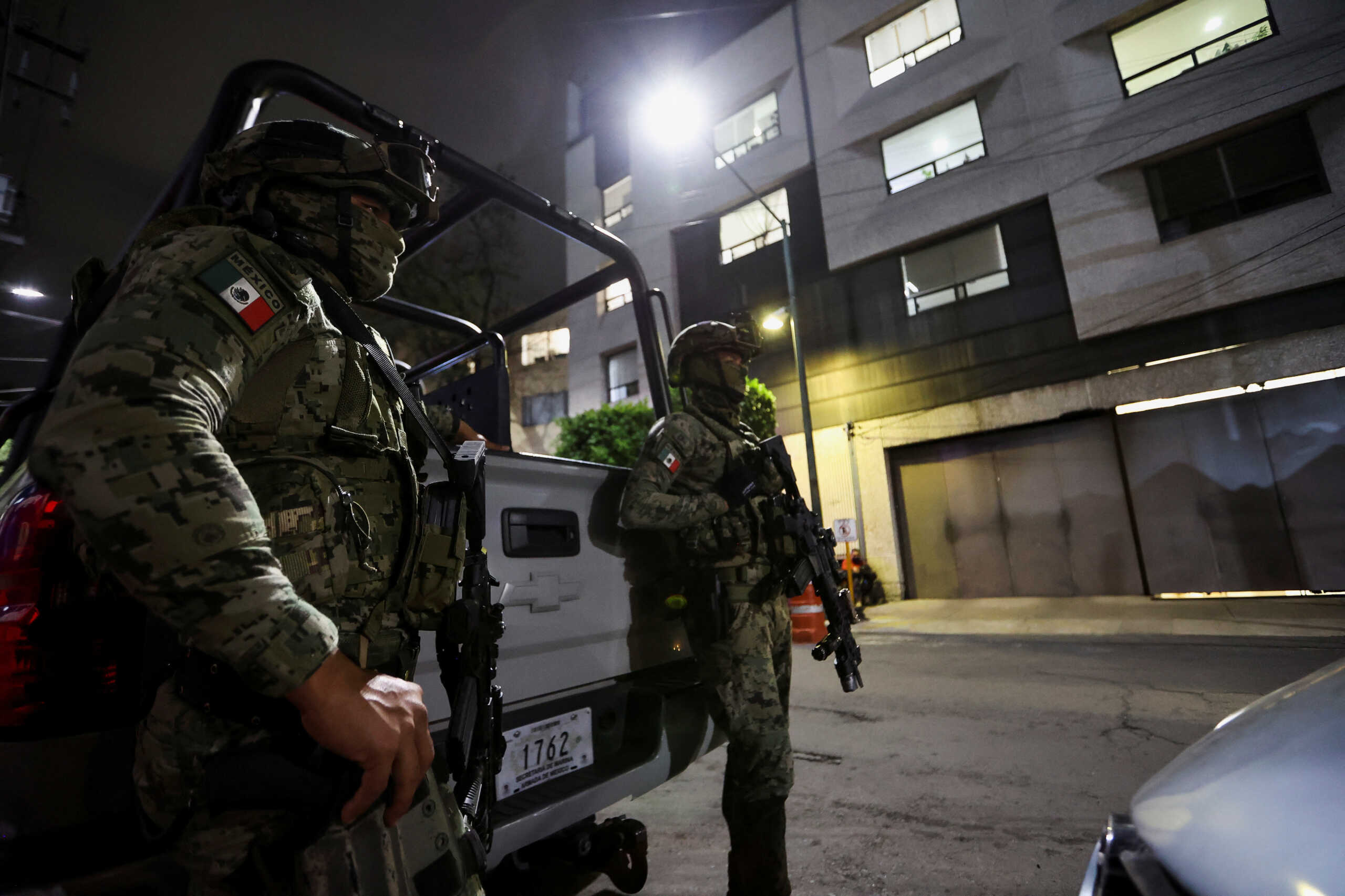 Members of the Mexican Navy keep watch outside the facilities of Mexico's Attorney General Office (PFR), where former attorney general Jesus Murillo, who served under former president Enrique Pena Nieto, has been arrested for charges of forced disappearance, torture and obstruction of justice in the 2014 disappearance of 43 students, is being held, in Mexico City, Mexico August 19, 2022. REUTERS