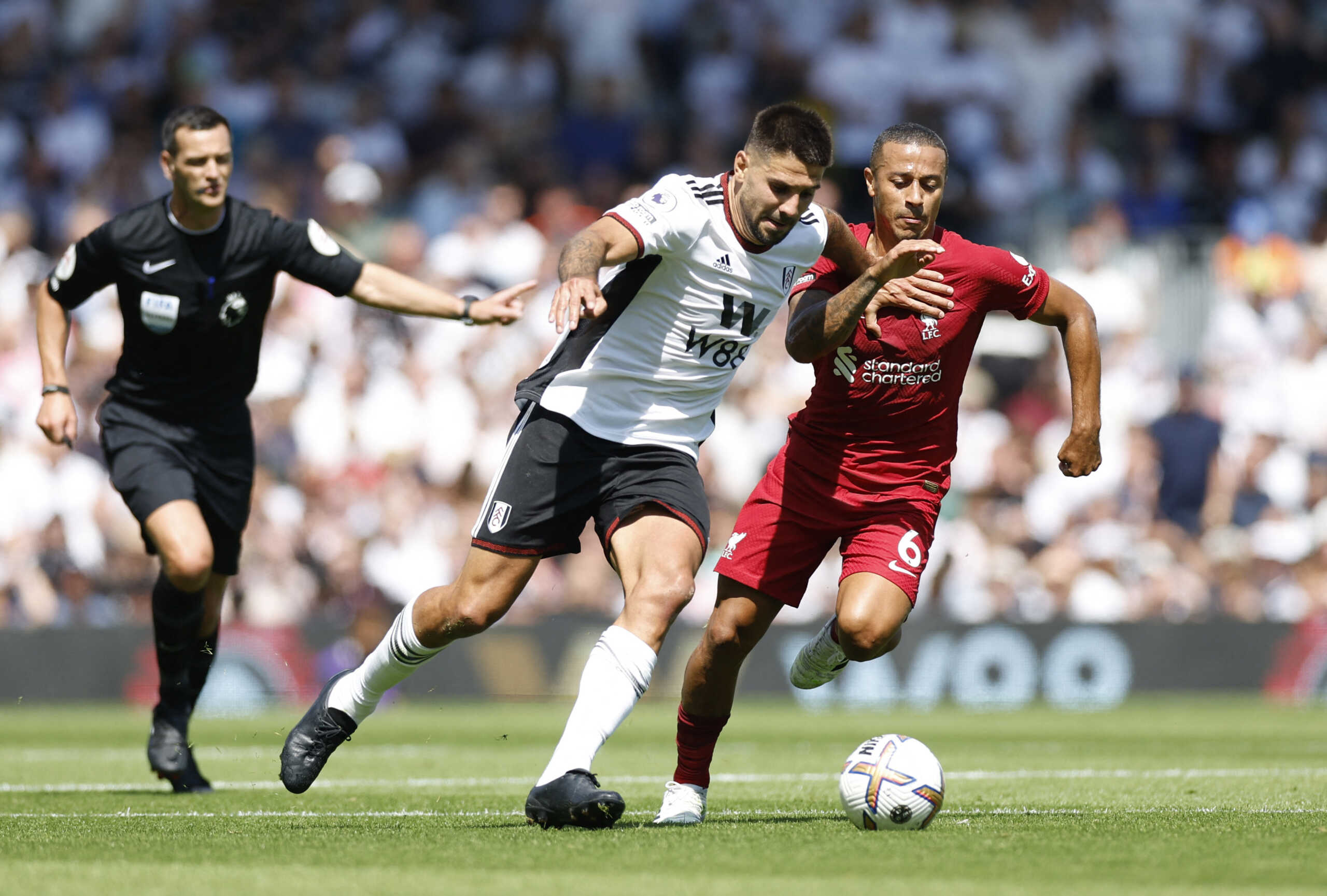Soccer Football - Premier League - Fulham v Liverpool - Craven Cottage, London, Britain - August 6, 2022 Fulham's Aleksandar Mitrovic in action with Liverpool's Thiago Alcantara Action Images via Reuters