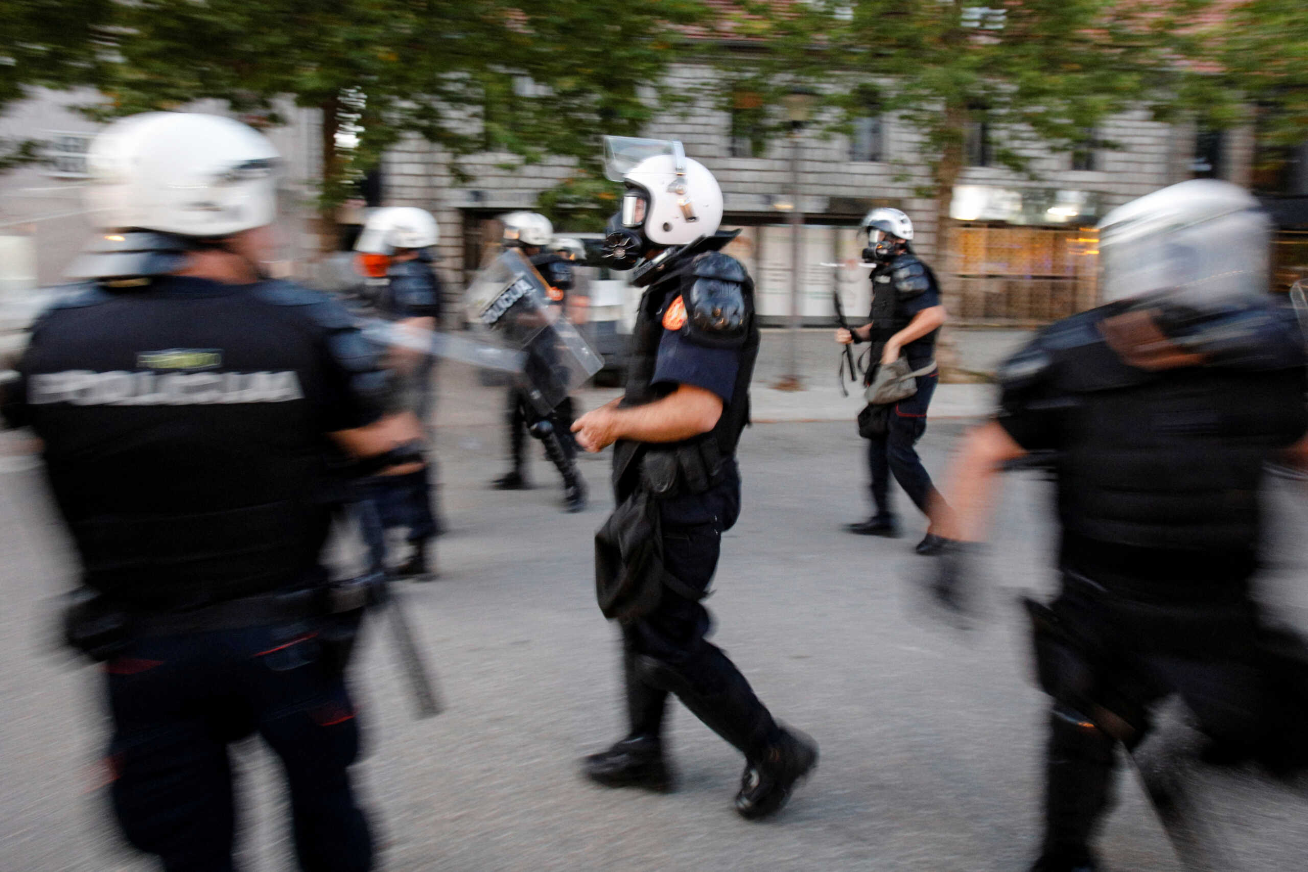 Police officers prepare to deploy tear gas on demonstrators after a protest rally to mark the unofficial celebration of Statehood Day in Niksic, Montenegro July 13, 2022. REUTERS