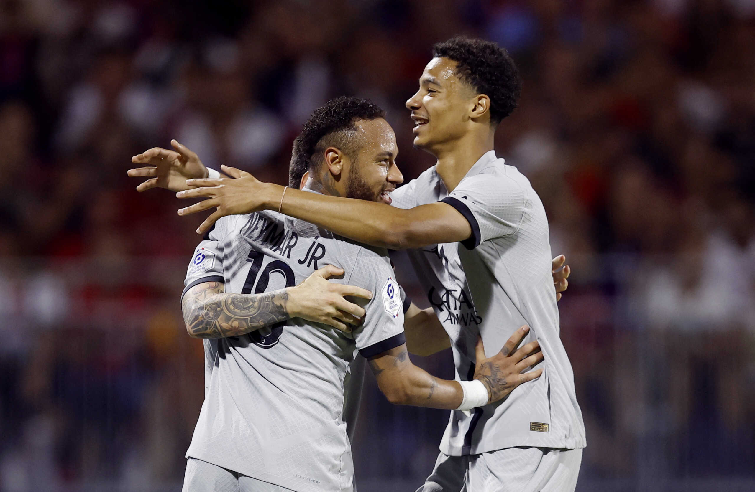 Soccer Football - Ligue 1 - Clermont v Paris St Germain - Stade Gabriel Montpied, Clermont-Ferrand, France - August 6, 2022  Paris St Germain's Lionel Messi celebrates scoring their fifth goal with Neymar and Hugo Ekitike REUTERS
