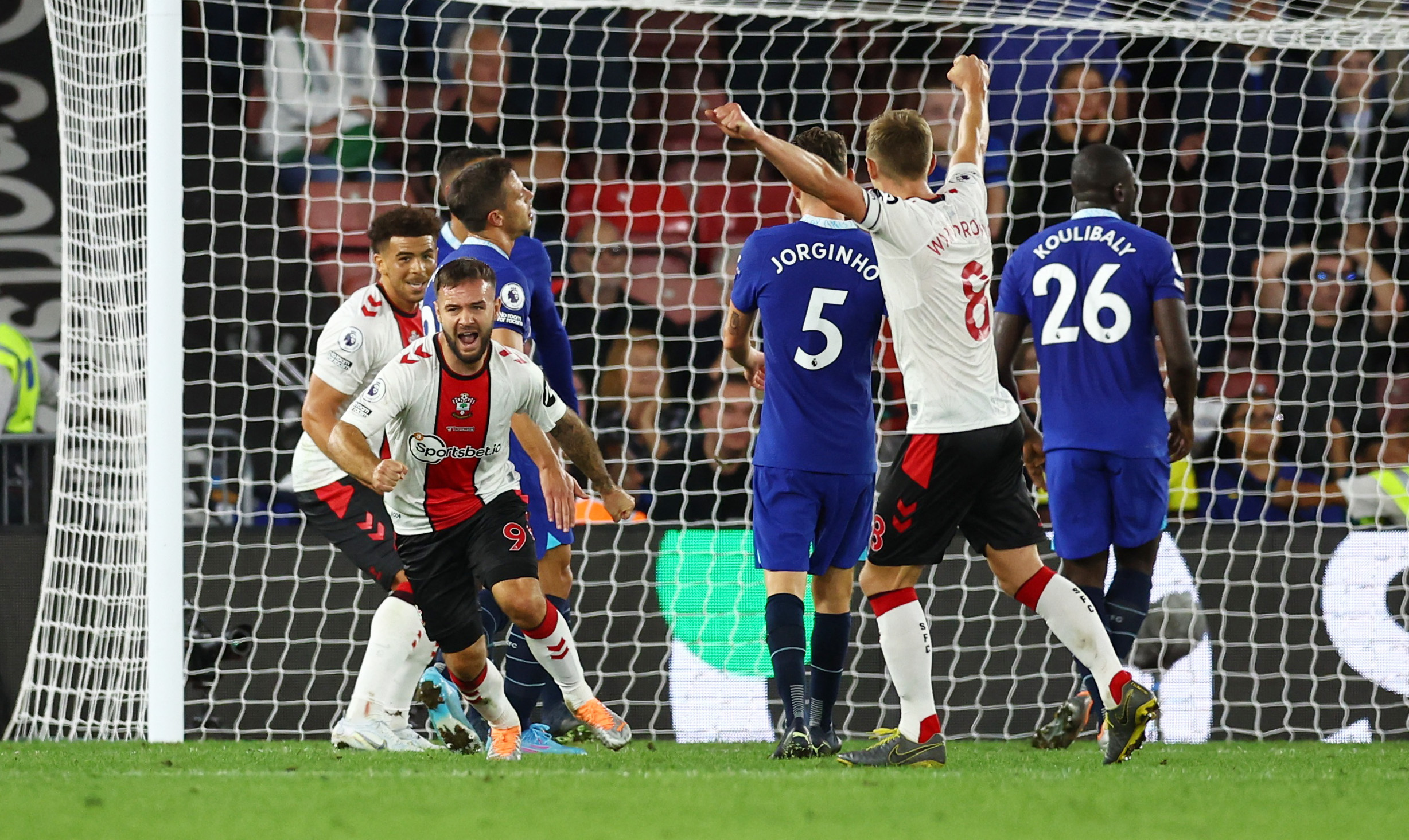 Soccer Football - Premier League - Southampton v Chelsea - St Mary's Stadium, Southampton, Britain - August 30, 2022 Southampton's Adam Armstrong celebrates scoring their second goal with Che Adams and James Ward-Prowse REUTERS