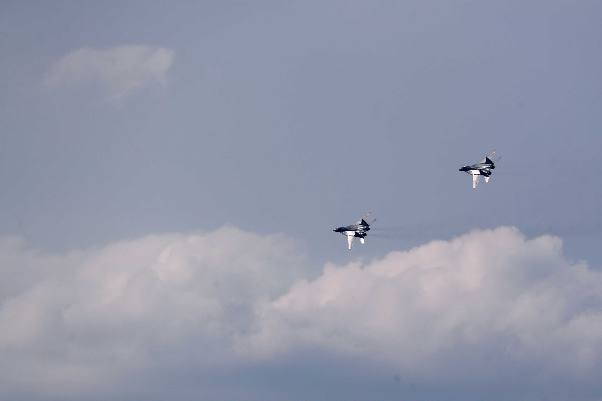 Russian-made MiG-29 fighter jets fly over the Malacky Air Base, near Malacky, Slovakia, August 27, 2022. REUTERS