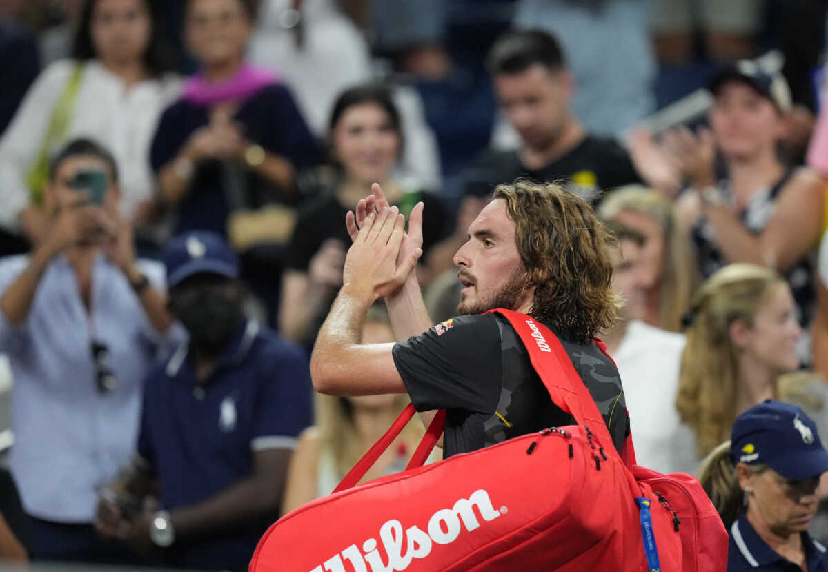 Aug 29, 2022; Flushing, NY, USA;   Stefanos Tsitsipas of Greece waves to the crowd after losing to Daniel Elahi Galan of Colombia in the first round on day one of the 2022 U.S. Open tennis tournament at USTA Billie Jean King National Tennis Center. Mandatory Credit: Jerry Lai-USA TODAY Sports
