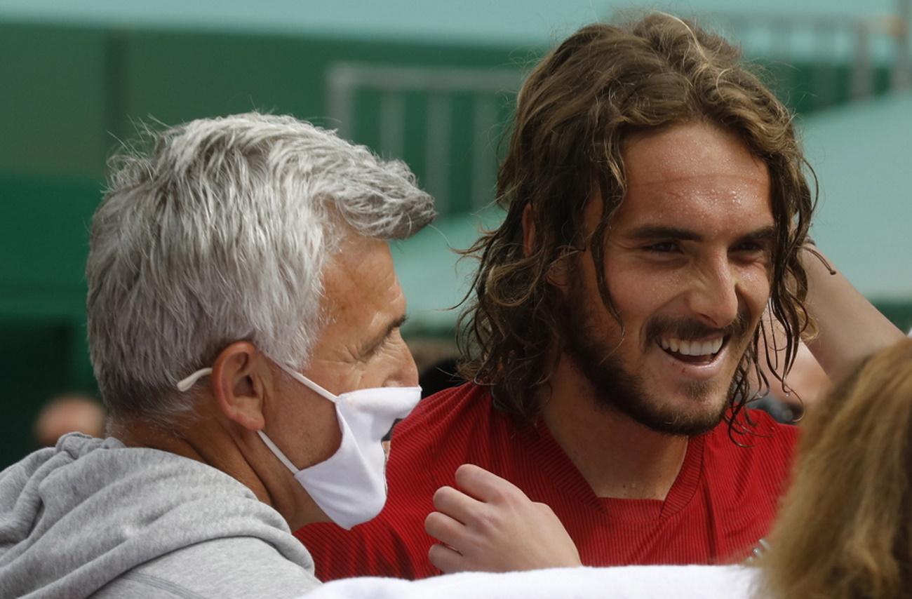 epa09143434 Stefanos Tsitsipas (R) of Greece celebrates with his father Apostolos Tsitsipas after beating Andrey Rublev of Russia in the final of the Monte-Carlo Rolex Masters tournament in Roquebrune Cap Martin, France, 18 April 2021.  EPA