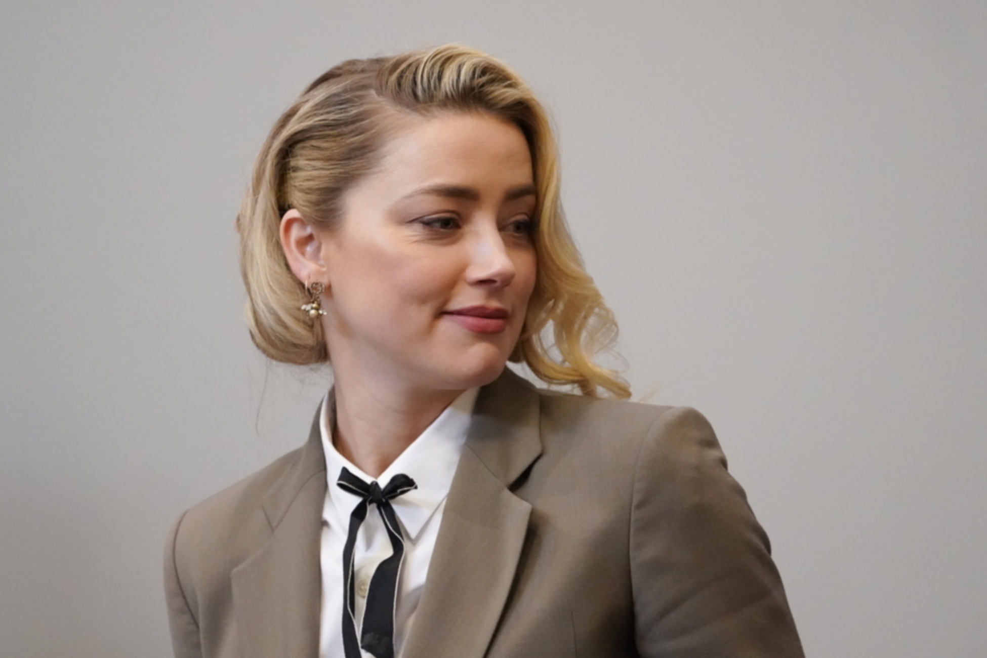 epa09969652 Actor Amber Heard arrives into the courtroom after a break at the Fairfax County Circuit Courthouse in Fairfax, Virginia, USA, 23 May 2022. Johnny Depp's 50 million US dollar defamation lawsuit against Amber Heard started on 10 April.  EPA