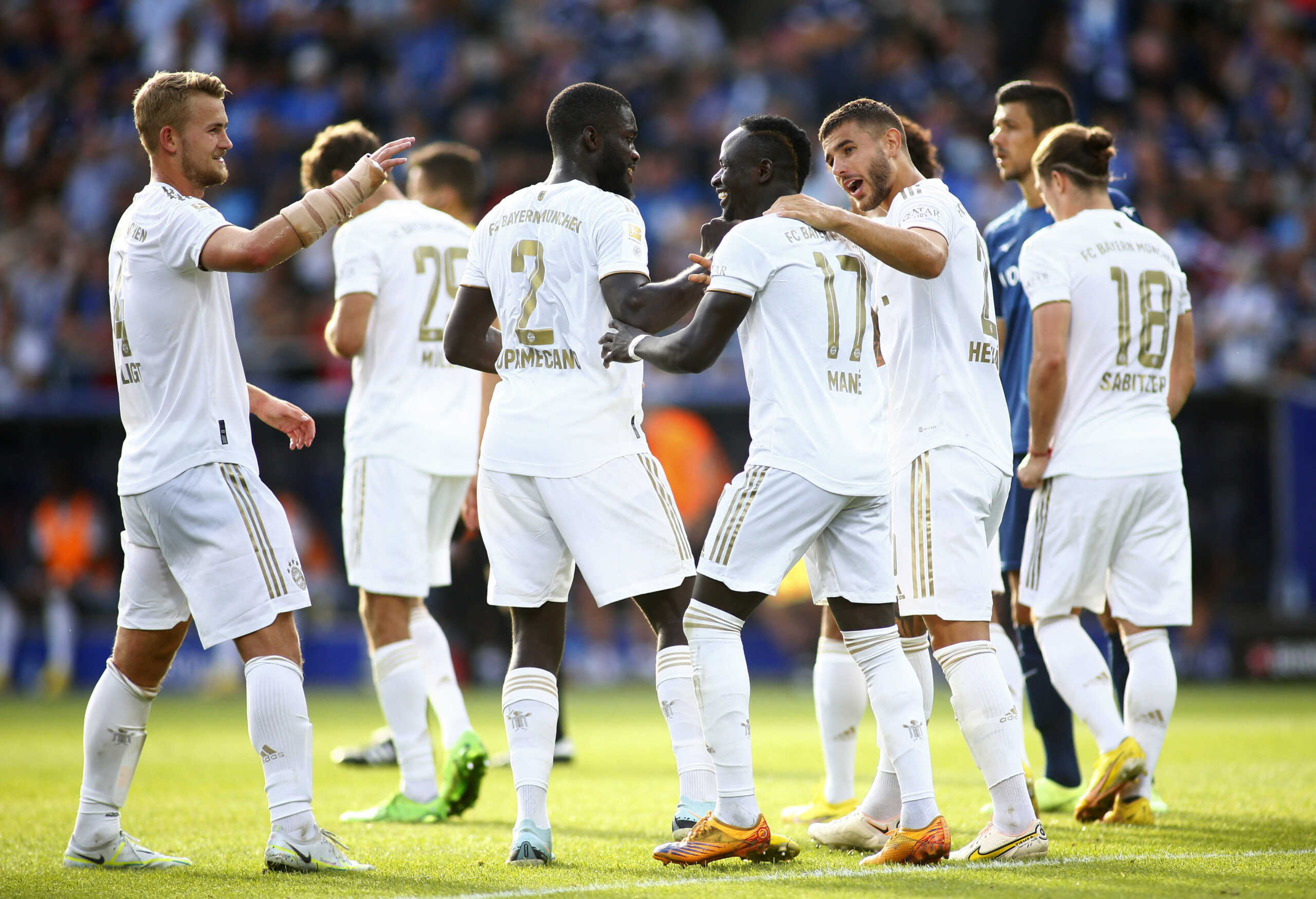 Soccer Football - Bundesliga - VfL Bochum v Bayern Munich - Stadion An der Alten Forsterei, Bochum, Germany - August 21, 2022 Bayern Munich's Sadio Mane celebrates scoring their fifth goal with Dayot Upamecano and Lucas Hernandez REUTERS
