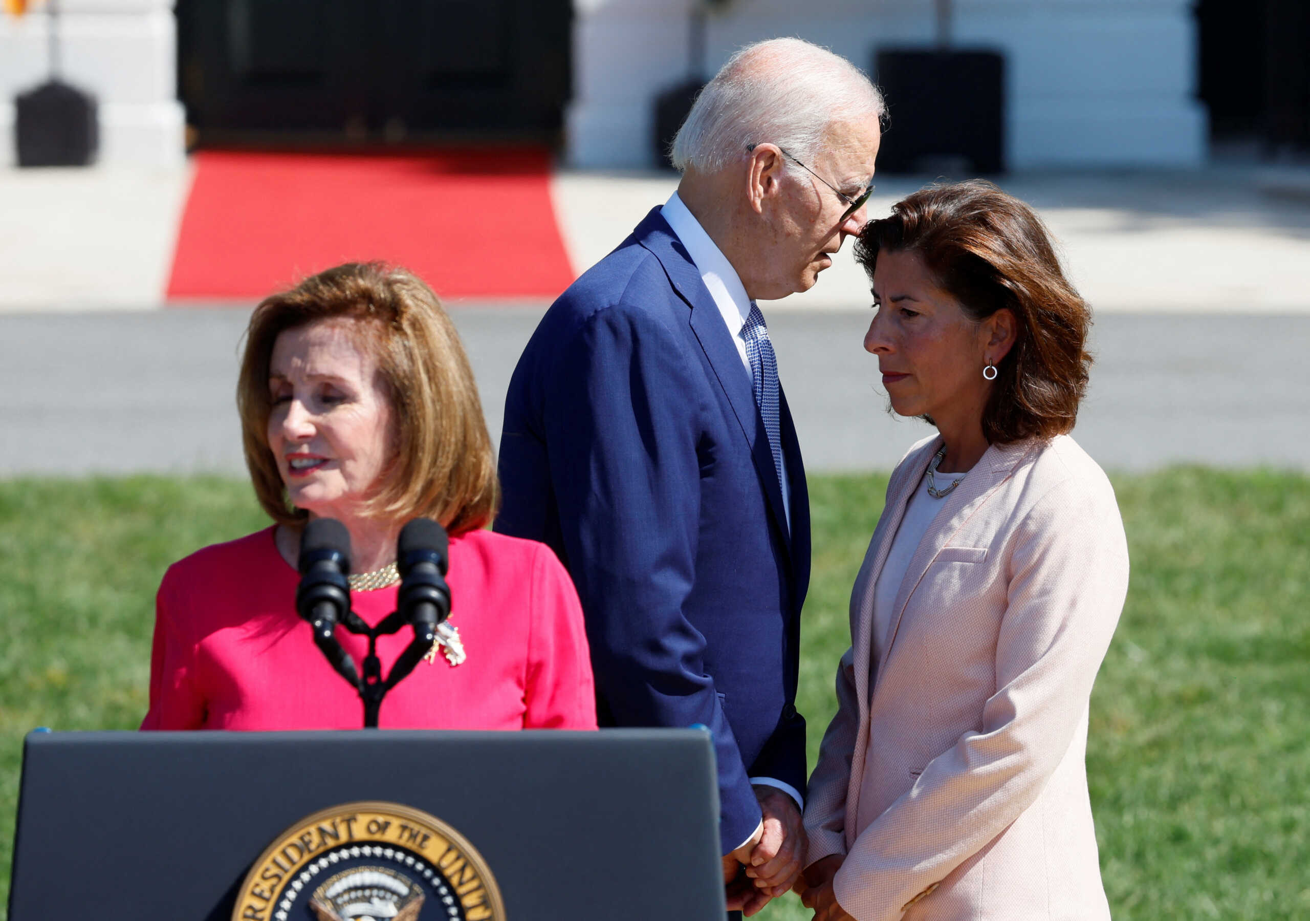 U.S. House of Representatives Speaker Nancy Pelosi delivers remarks alongside U.S. President Joe Biden and U.S. Commerce Secretary Gina Raimondo during an event to sign the CHIPS and Science Act of 2022, on the South Lawn of the White House in Washington, U.S., August 9, 2022. REUTERS