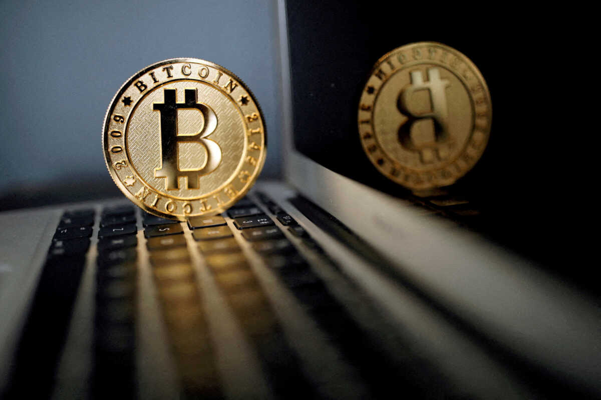 FILE PHOTO: A bitcoin representation is seen in an illustration picture taken at La Maison du Bitcoin in Paris, France, June 23, 2017. REUTERS