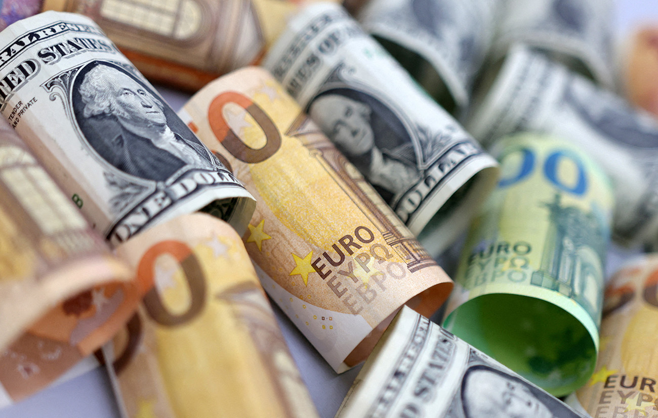 FILE PHOTO: U.S. Dollar and Euro banknotes are seen in this illustration taken July 17, 2022. REUTERS
