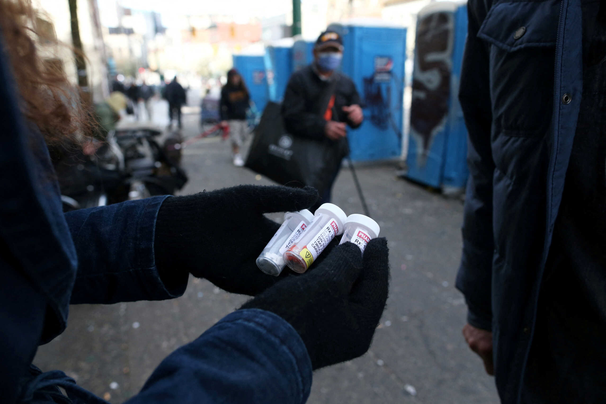 FILE PHOTO: A fentanyl user displays a "safe supply" of opioid alternatives, provided by the local health unit to combat overdoses due to poisonous additives and to support addicts and the homeless in practicing social distancing to help slow the spread of coronavirus disease (COVID-19) in the Downtown Eastside of Vancouver, British Columbia, Canada April 6, 2020. Picture taken April 6, 2020. REUTERS