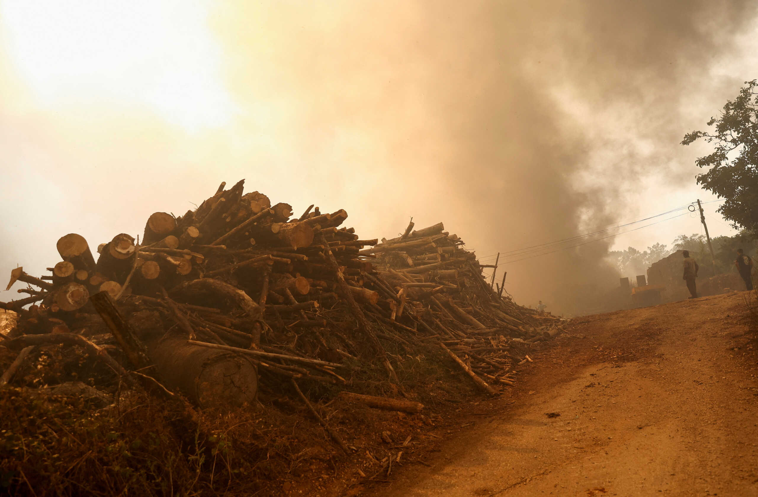 FILE PHOTO: Smoke billows after a wild fire, in Leiria, Portugal July 13, 2022. REUTERS