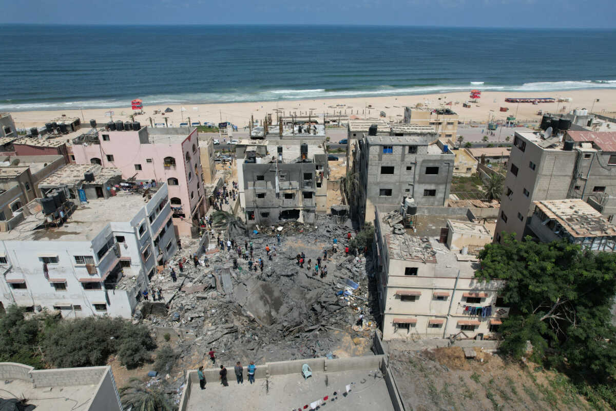 Palestinians inspect a house hit in an Israeli air strike, amid Israel-Gaza fighting, in Gaza cityAugust 6, 2022. REUTERS