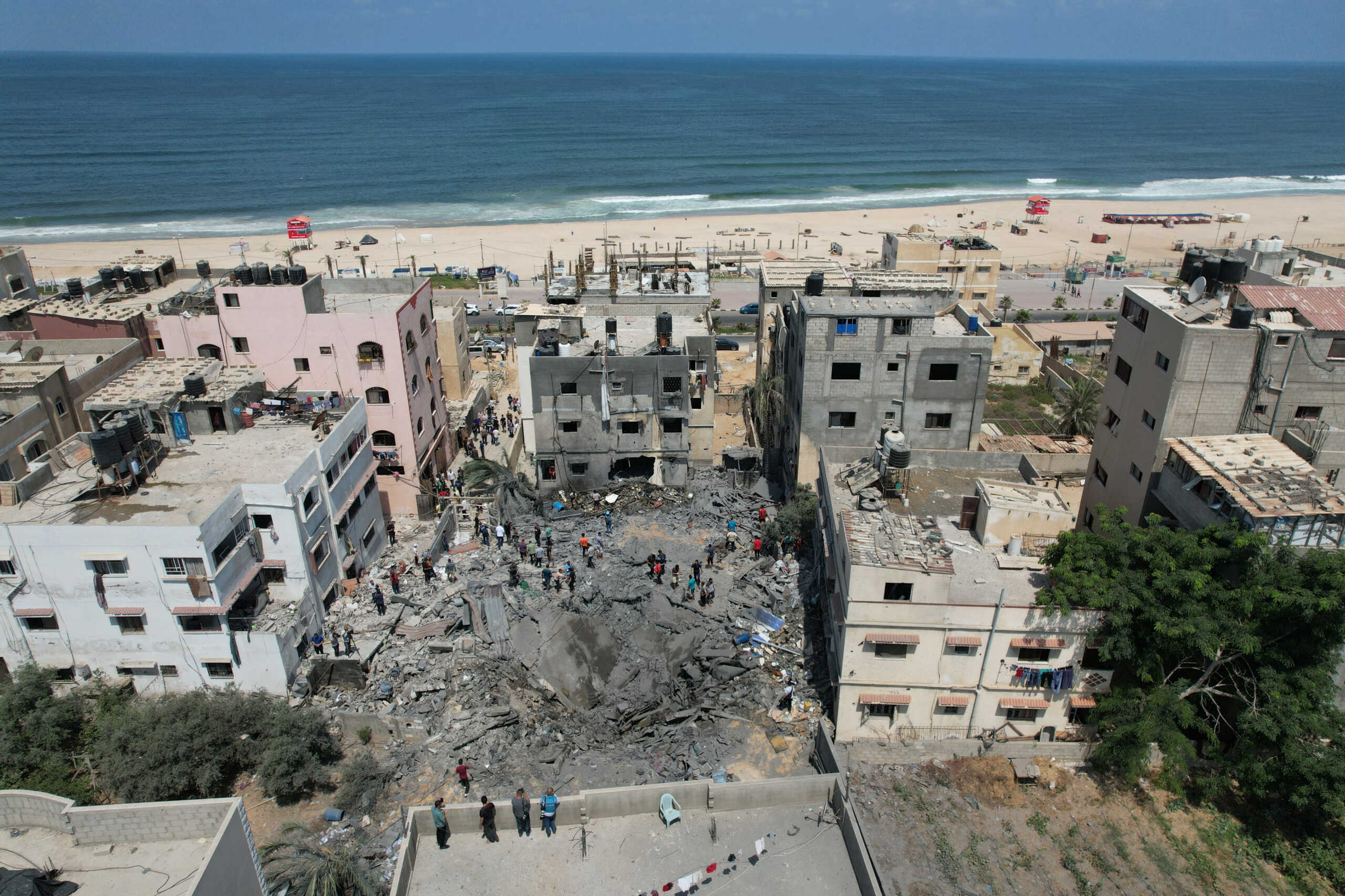 Palestinians inspect a house hit in an Israeli air strike, amid Israel-Gaza fighting, in Gaza cityAugust 6, 2022. REUTERS