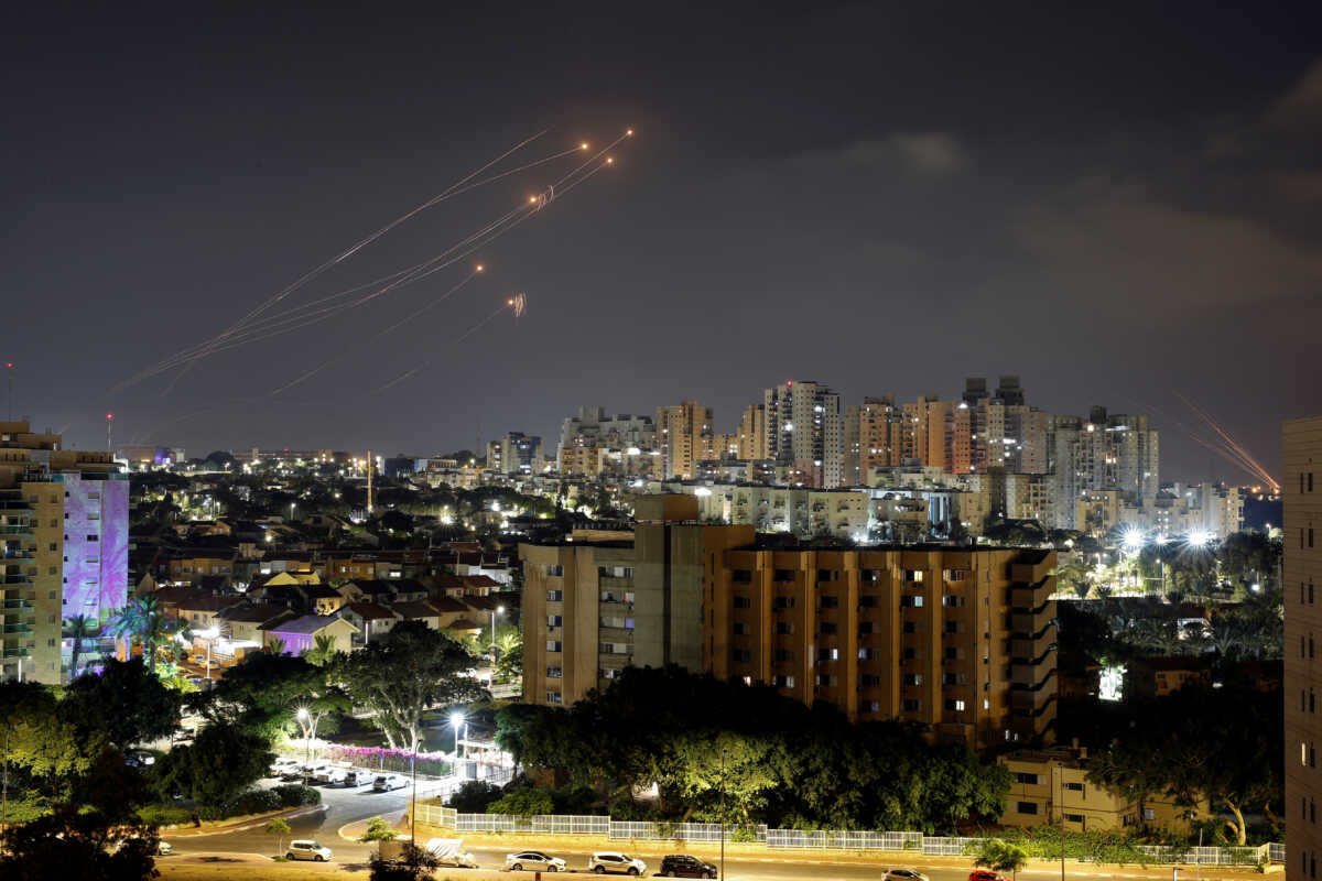 Streaks of light are seen as Israel's Iron Dome anti-missile system intercepts rockets launched from the Gaza Strip towards Israel, as seen from Ashkelon, Israel August 6, 2022. REUTERS