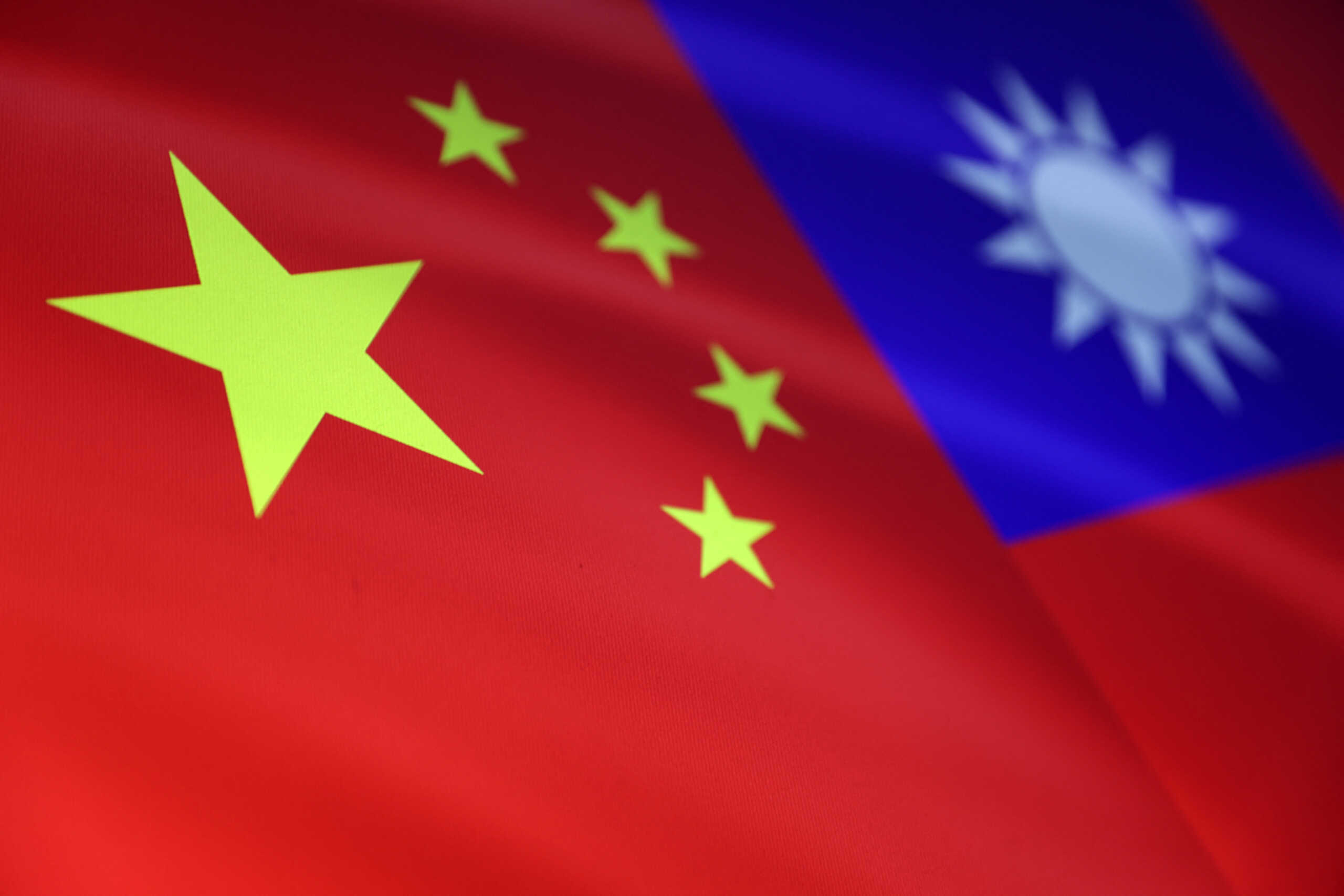 Chinese and Taiwanese flags are seen in this illustration, August 6, 2022. REUTERS