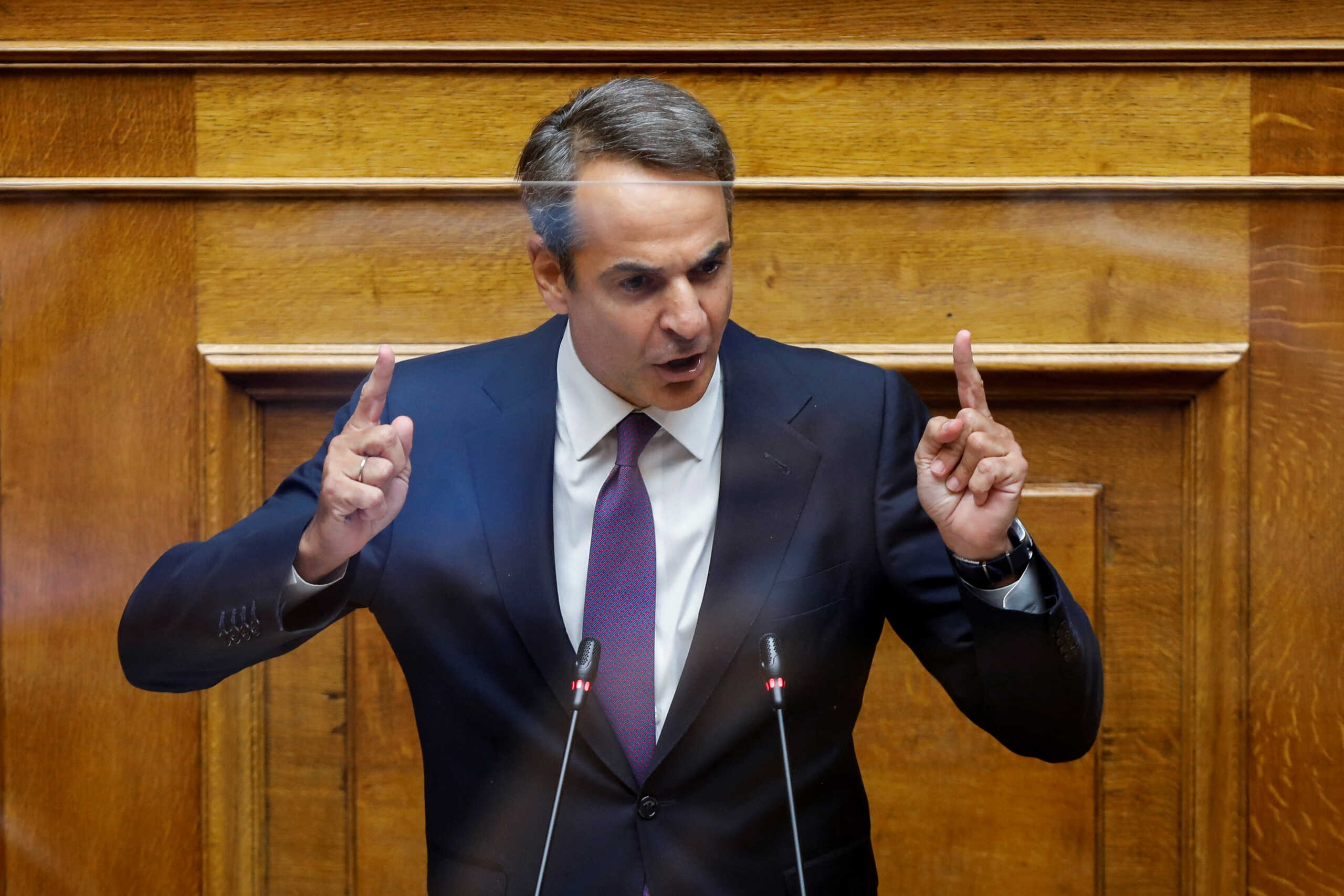 Greek Prime Minister Kyriakos Mitsotakis addresses lawmakers during a parliamentary session on a wiretapping case, in Athens, Greece, August 26, 2022. REUTERS