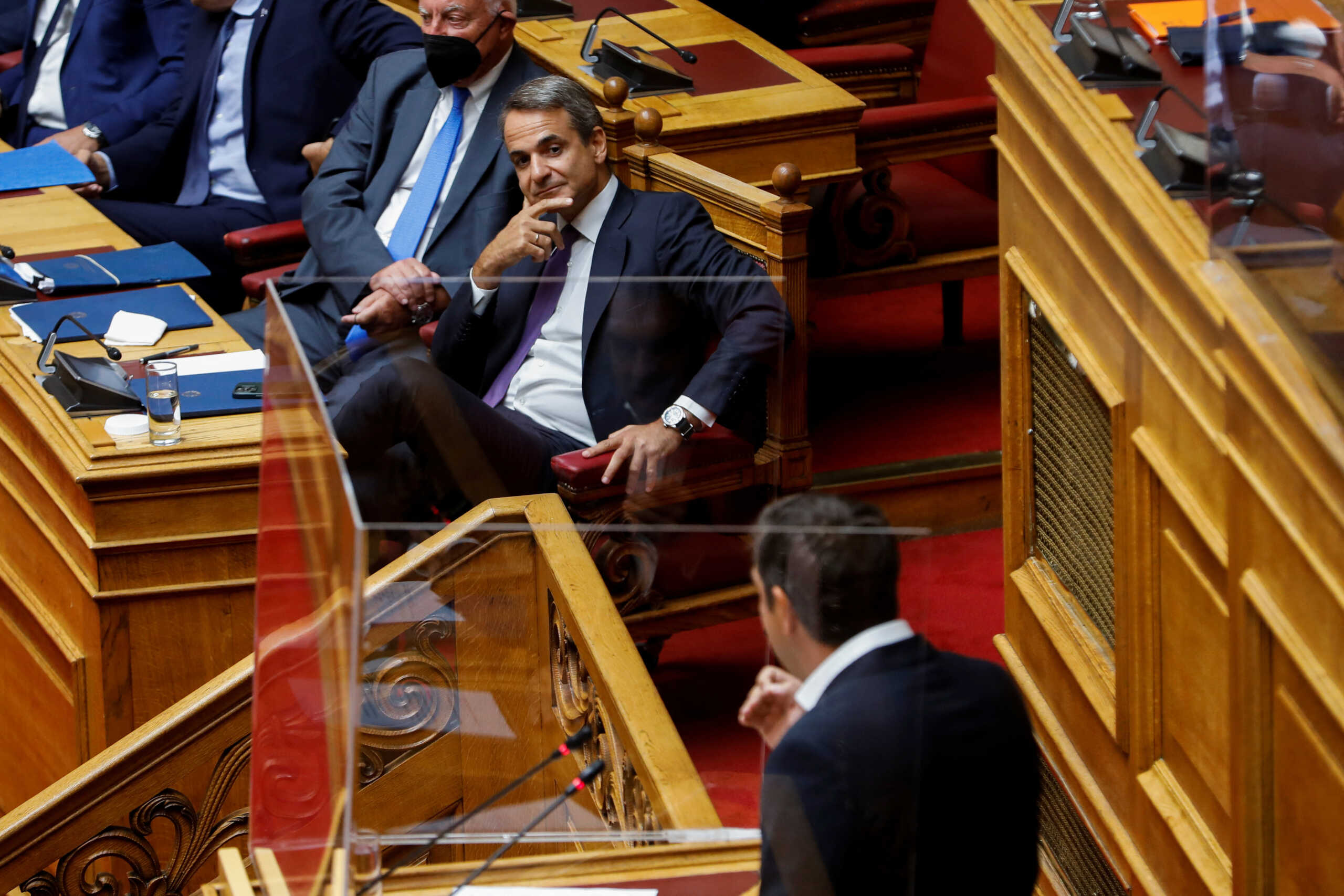 Greek Prime Minister Kyriakos Mitsotakis addresses lawmakers during a parliamentary session on a wiretapping case, in Athens, Greece, August 26, 2022. REUTERS