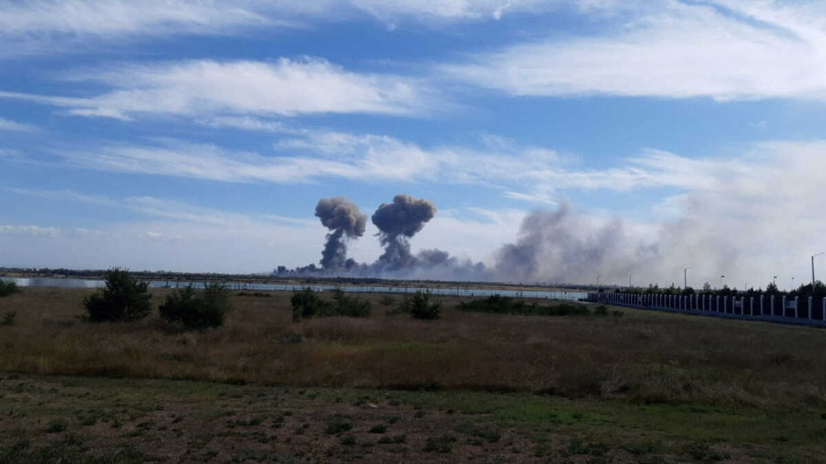 FILE PHOTO: Smoke rises after explosions were heard from the direction of a Russian military airbase near Novofedorivka, Crimea, in this still image obtained by Reuters August 9, 2022. THIS IMAGE HAS BEEN SUPPLIED BY A THIRD PARTY.
