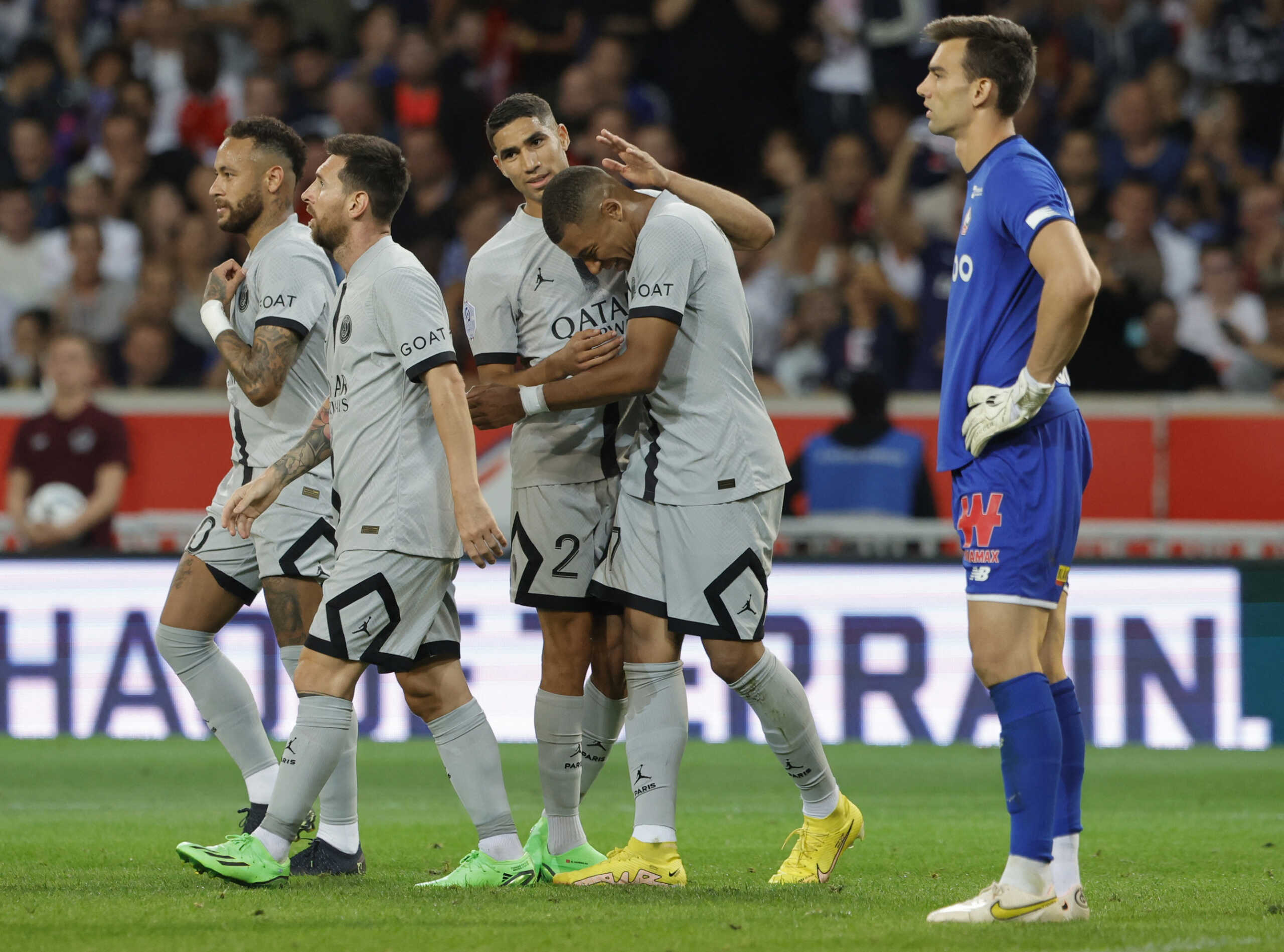 Soccer Football - Ligue 1 - Lille v Paris St Germain - Stade Pierre-Mauroy, Villeneuve-d'Ascq, France - August 21, 2022 Paris St Germain's Kylian Mbappe celebrates scoring their sixth goal with teammates REUTERS