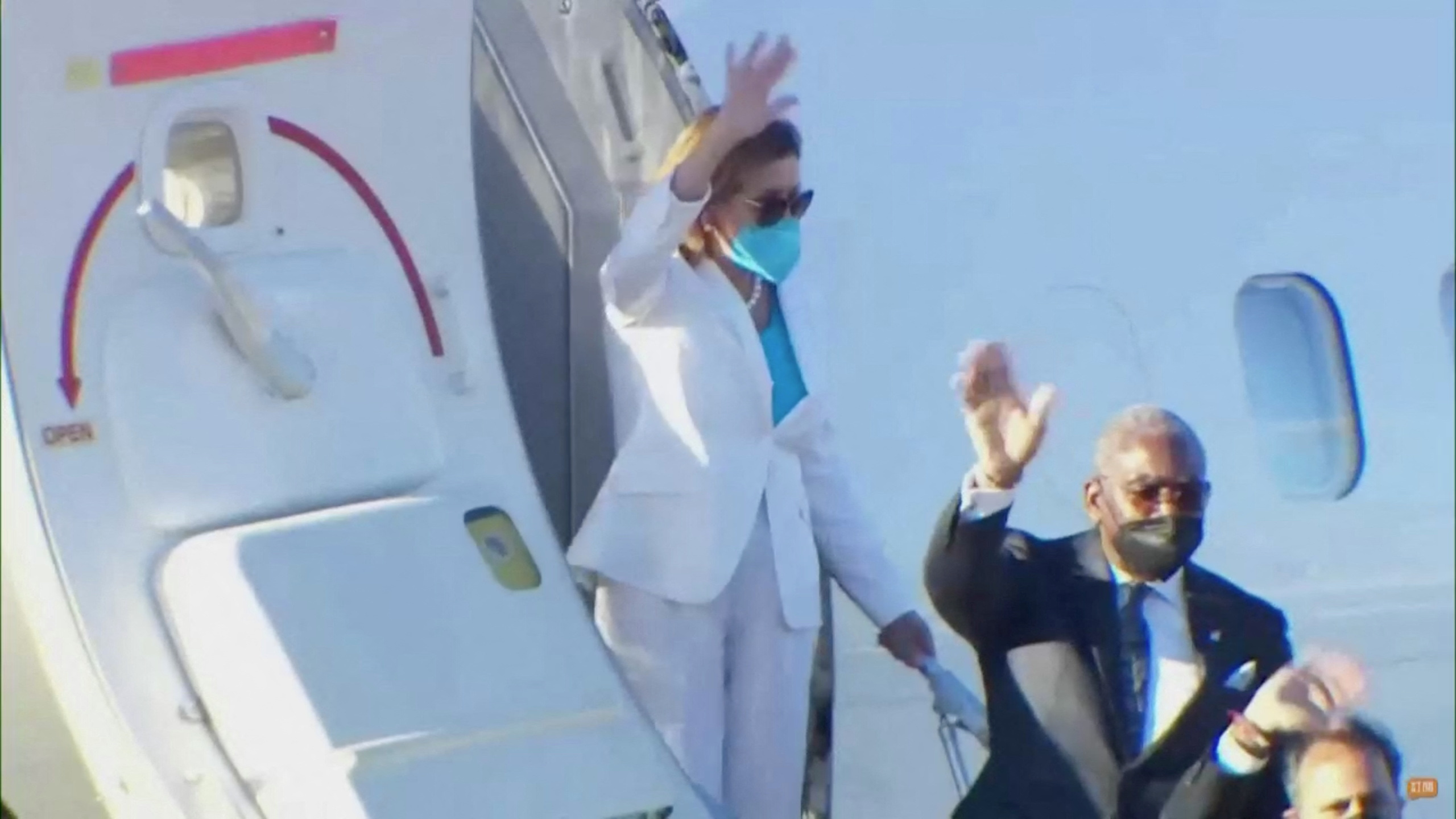 U.S. House of Representatives Speaker Nancy Pelosi waves as she boards a plane before leaving Taipei Songshan Airport in Taipei, Taiwan August 3, 2022, in this screengrab taken from video. REUTERS TV