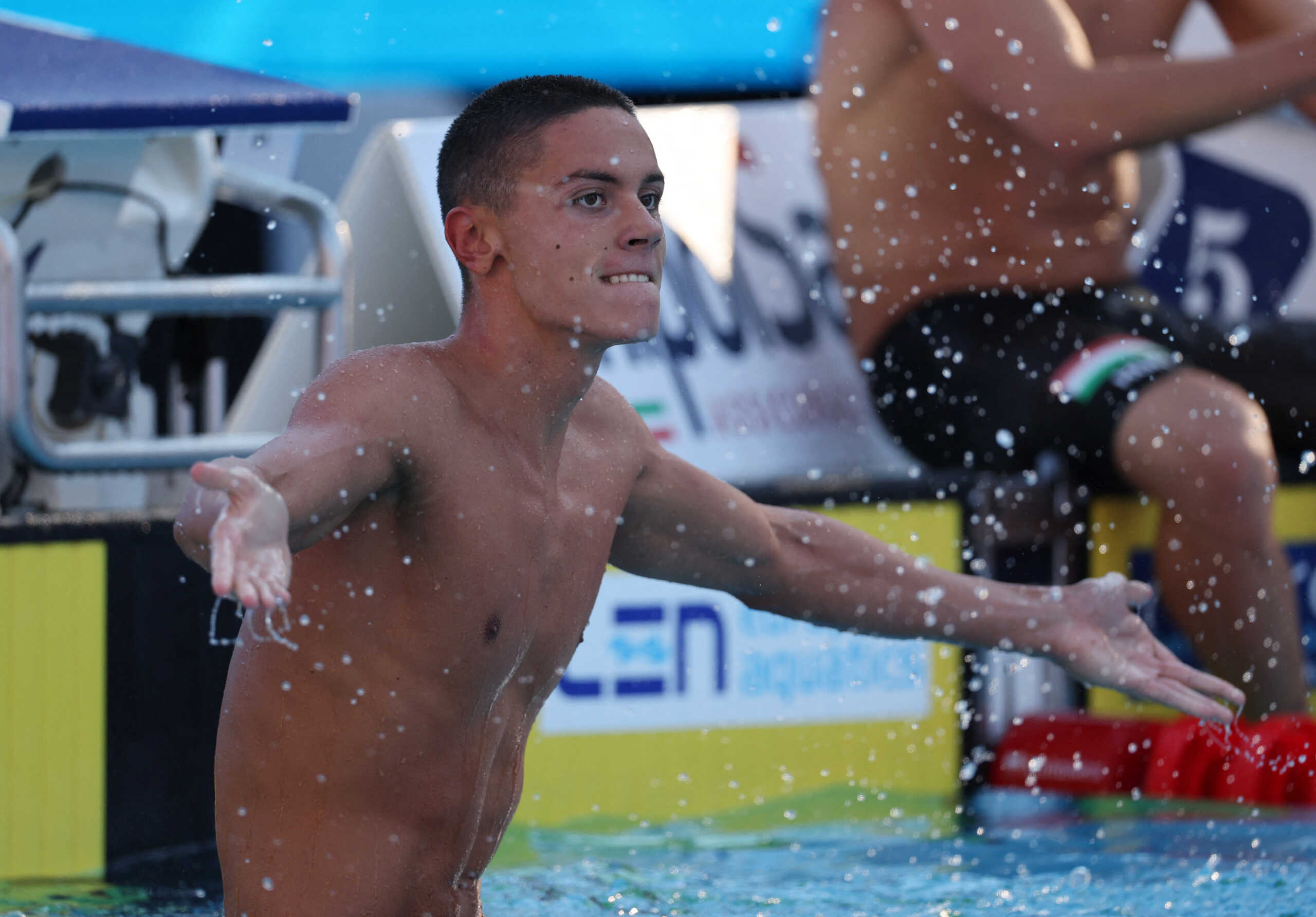 European Aquatics Championships - Swimming - Stadio Olimpico del Nuoto, Rome, Italy - August 13, 2022 Romania's David Popovici reacts after winning the men's 100m freestyle final REUTERS