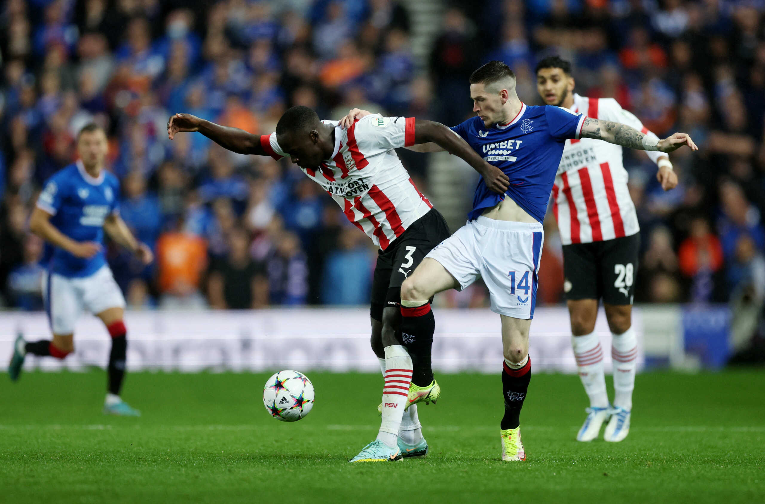 Soccer Football - Champions League Qualifying - Play-off First Leg - Rangers v PSV Eindhoven - Ibrox Stadium, Glasgow, Scotland, Britain - August 16, 2022 PSV Eindhoven's Jordan Teze in action with Rangers' Ryan Kent Action Images via Reuters