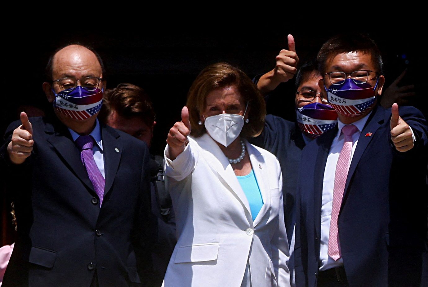 U.S. House of Representatives Speaker Nancy Pelosi gestures next to Legislative Yuan Vice President Tsai Chi-chang as she leaves the parliament in Taipei, Taiwan August 3, 2022. REUTERS
