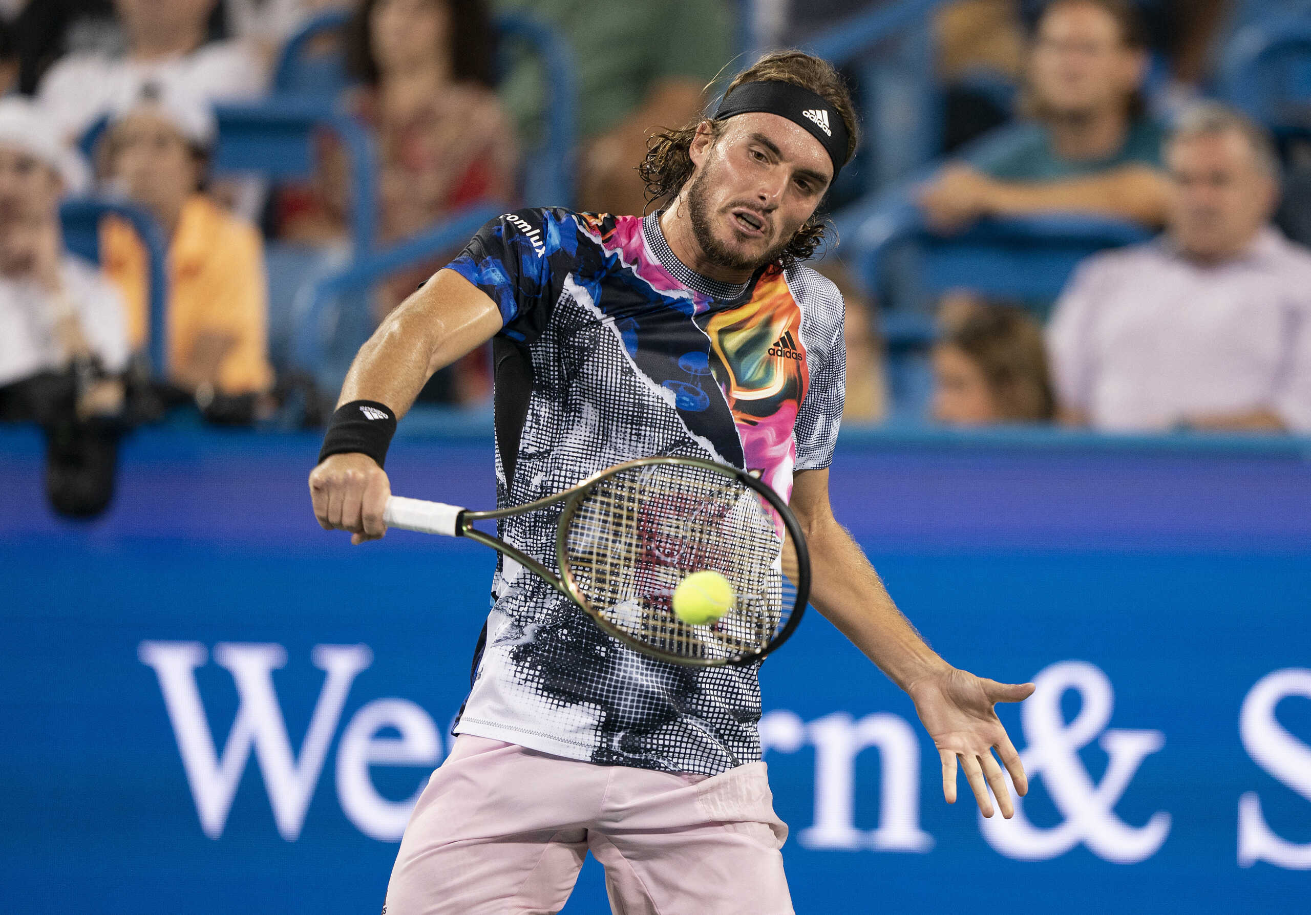 Aug 20, 2022; Cincinnati, OH, USA; Stefanos Tsitsipas (GRE) returns a shot against Daniil Medvedev (RUS) at the Western & Southern Open at the Lindner Family Tennis Center. Mandatory Credit: Susan Mullane-USA TODAY Sports