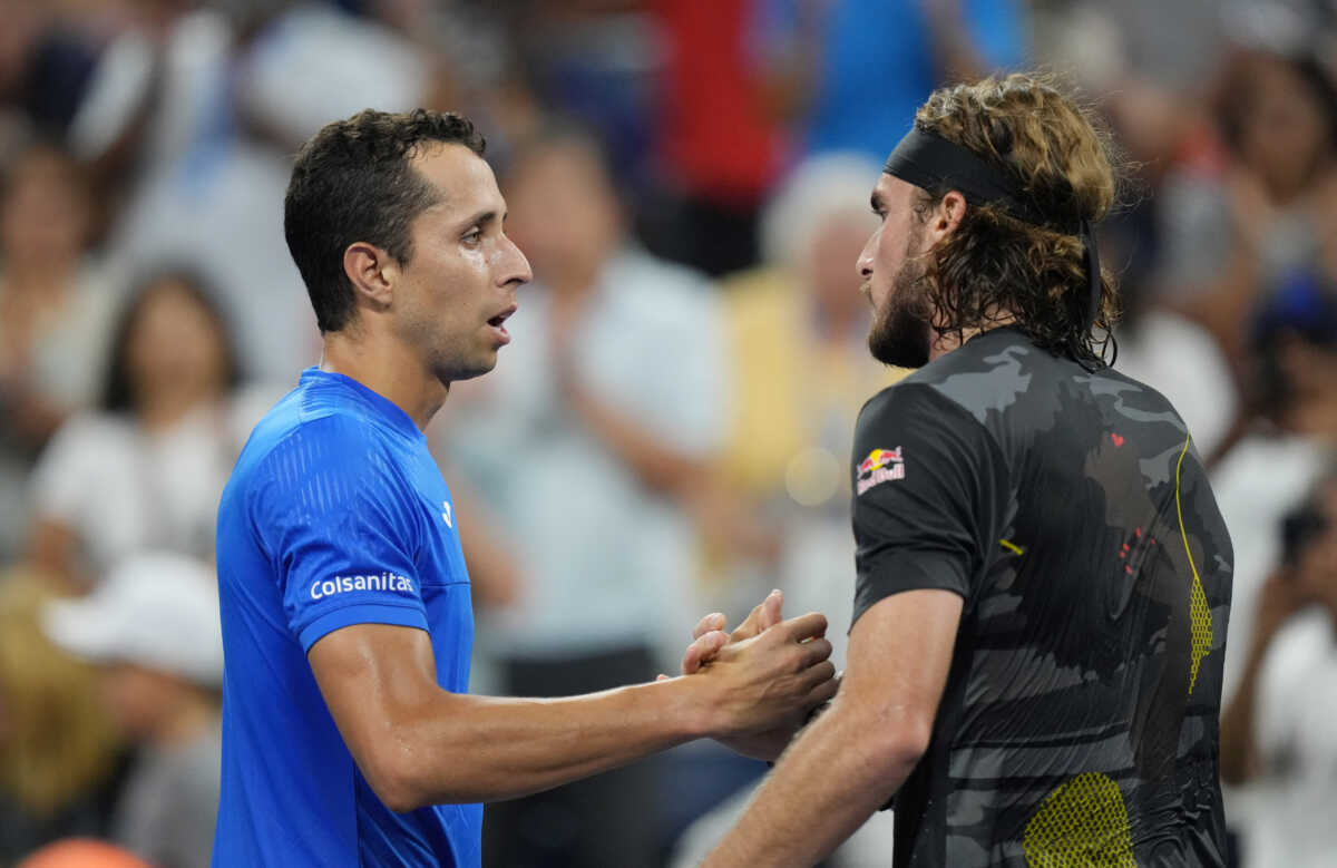 Aug 29, 2022; Flushing, NY, USA;  Daniel Elahi Galan of Colombia, left, and  Stefanos Tsitsipas of Greece shake hands after their first round match on day one of the 2022 U.S. Open tennis tournament at USTA Billie Jean King National Tennis Center. Mandatory Credit: Jerry Lai-USA TODAY Sports