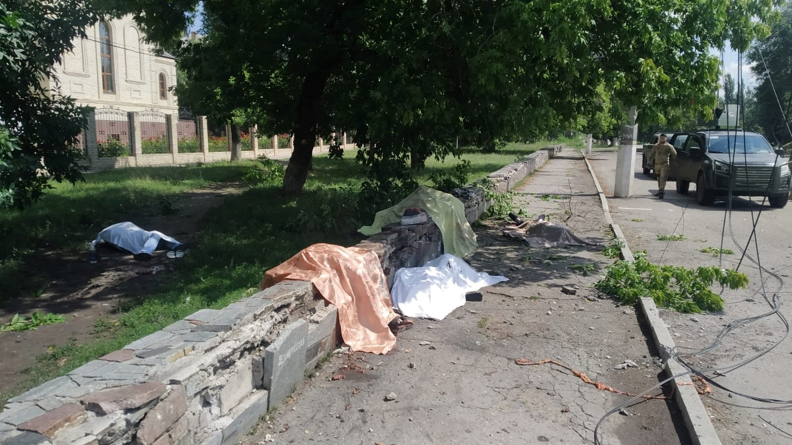 SENSITIVE MATERIAL. THIS IMAGE MAY OFFEND OR DISTURB Bodies of people killed by a Russian military strike are pictured near a stop of a public transport in the town of Toretsk, as Russia's attack on Ukraine continues, in Donetsk region, Ukraine August 4, 2022. Press service of the Donetsk Regional Military-Civil Administration