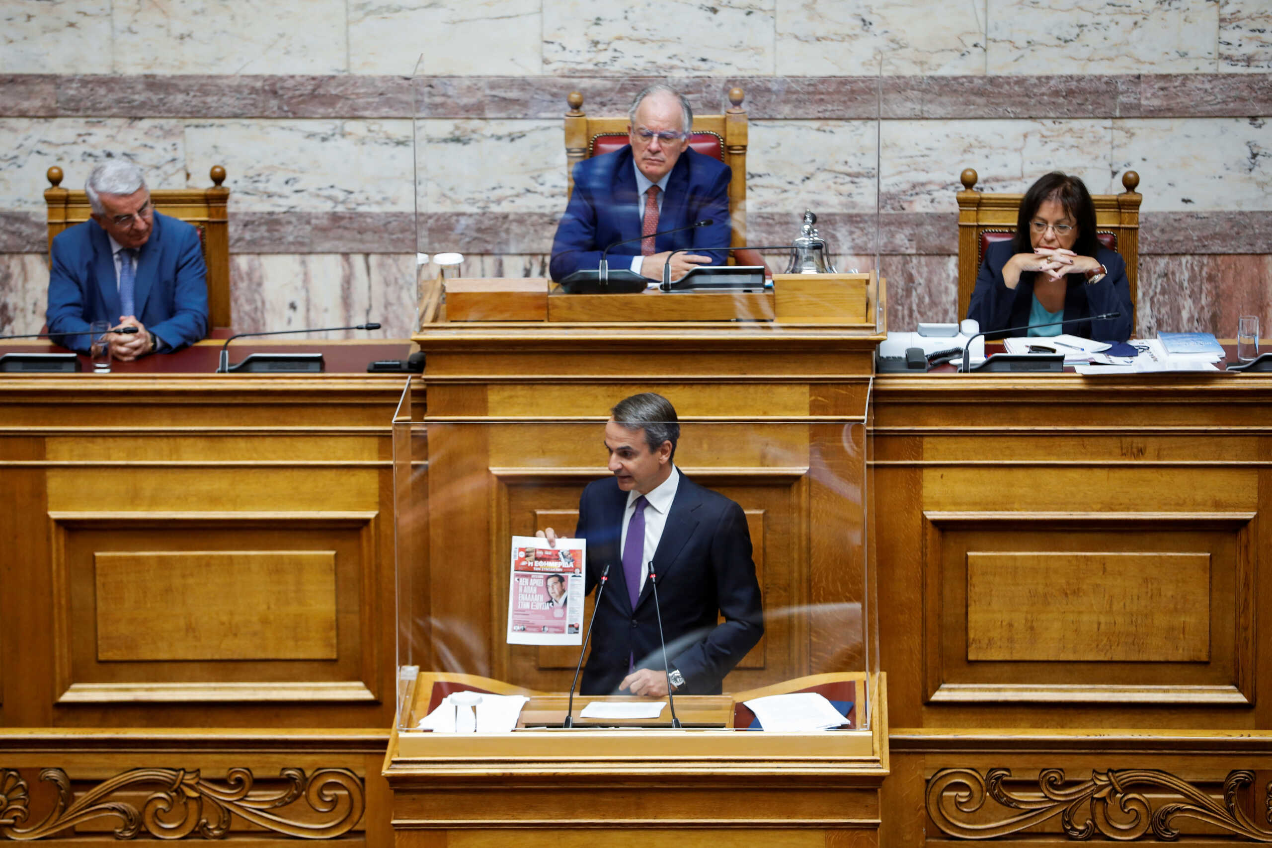 Greek Prime Minister Kyriakos Mitsotakis addresses lawmakers during a parliamentary session on a wiretapping case, in Athens, Greece, August 26, 2022. REUTERS