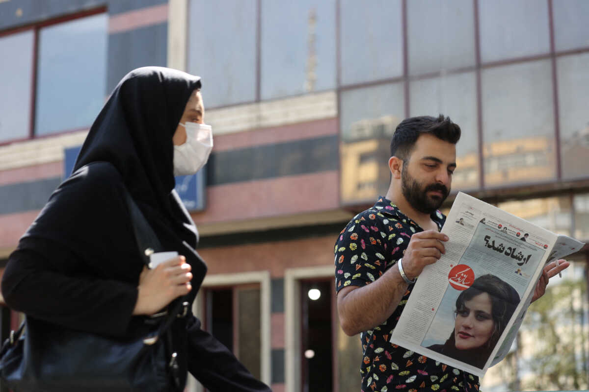 A man views a newspaper with a cover picture of Mahsa Amini, a woman who died after being arrested by the Islamic republic's "morality police" in Tehran, Iran September 18, 2022. Majid Asgaripour