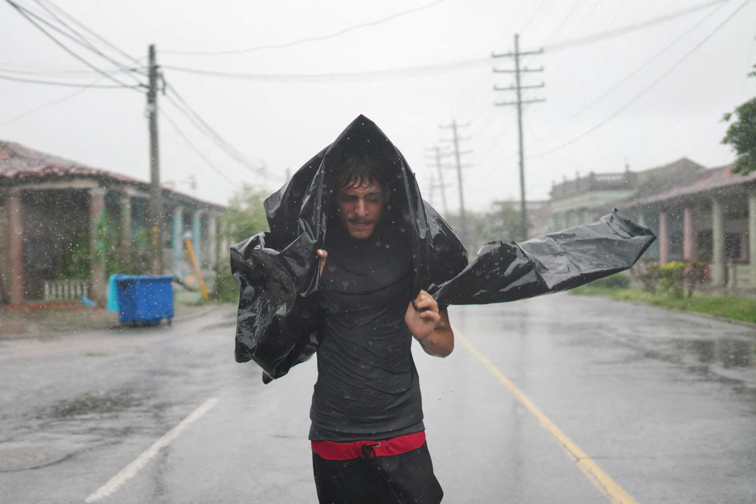A man runs on the streets during the passage of Hurricane Ian in Pinar del Rio, Cuba, September 27, 2022. REUTERS